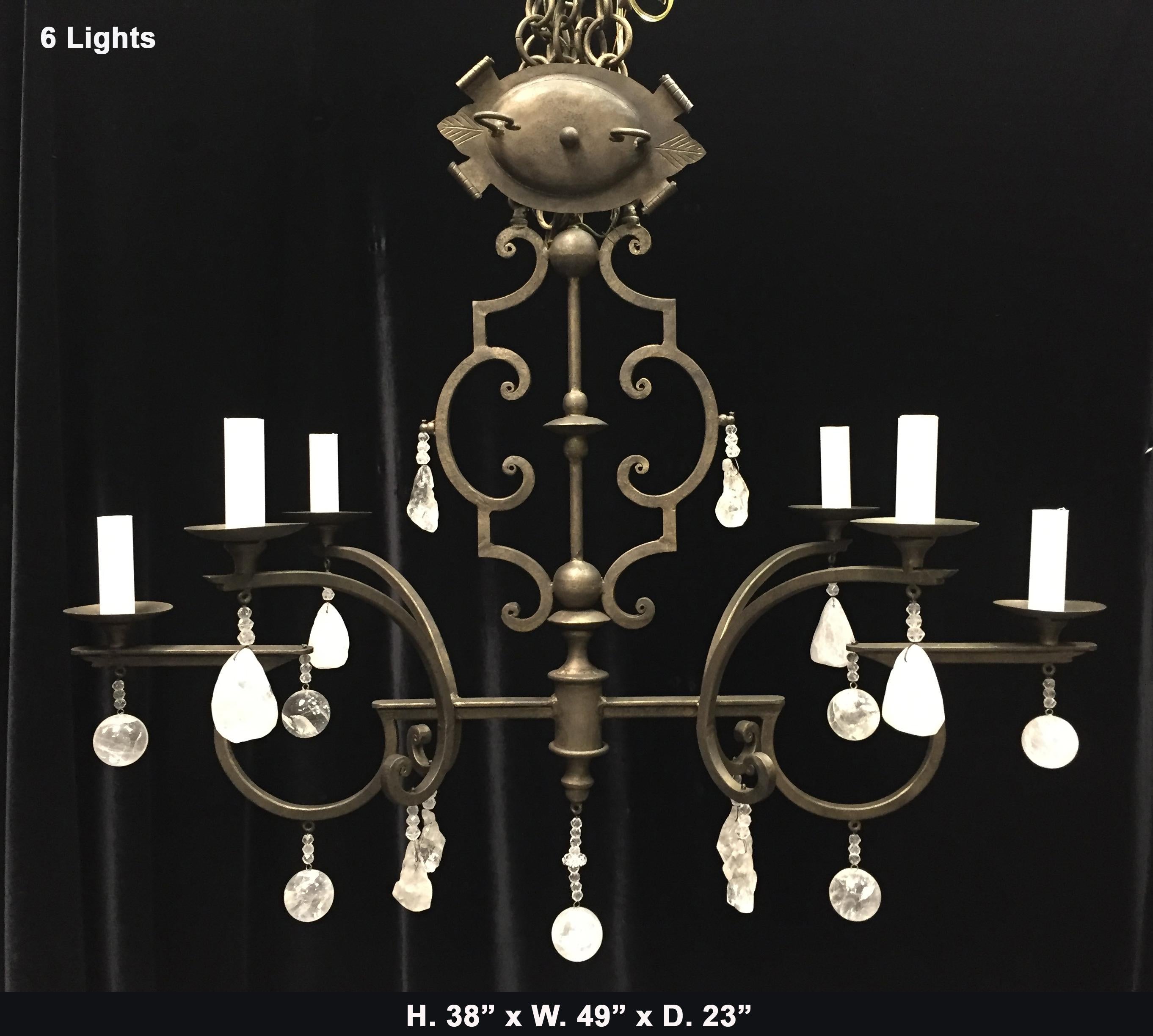 Desirable rock crystal and hand forged wrought iron oblong six light chandelier.
It comes with chain and canopy in addition to handmade bees wax candle sleeves.
Sizes available :
H. 31