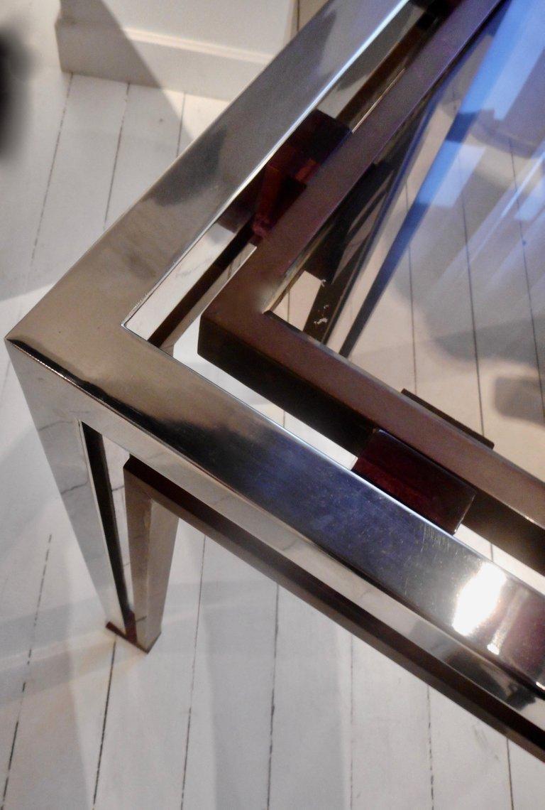 Sculptural console table, geometric chrome and brass frame. The smocked glass top rests on red perspex cubes. By Romeo Rega, Italy, 1970.
 