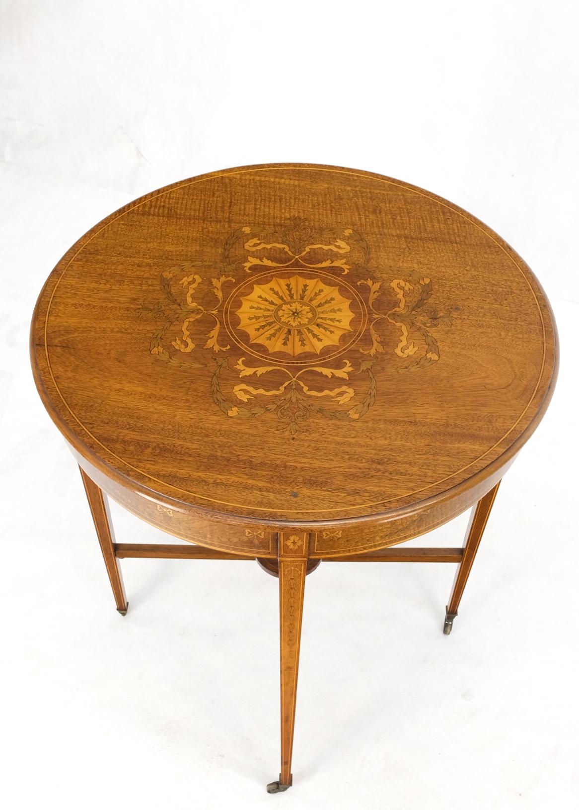 Fine Round Inlay Side Lamp Table on Brass on Tapered Legs and Wheels.