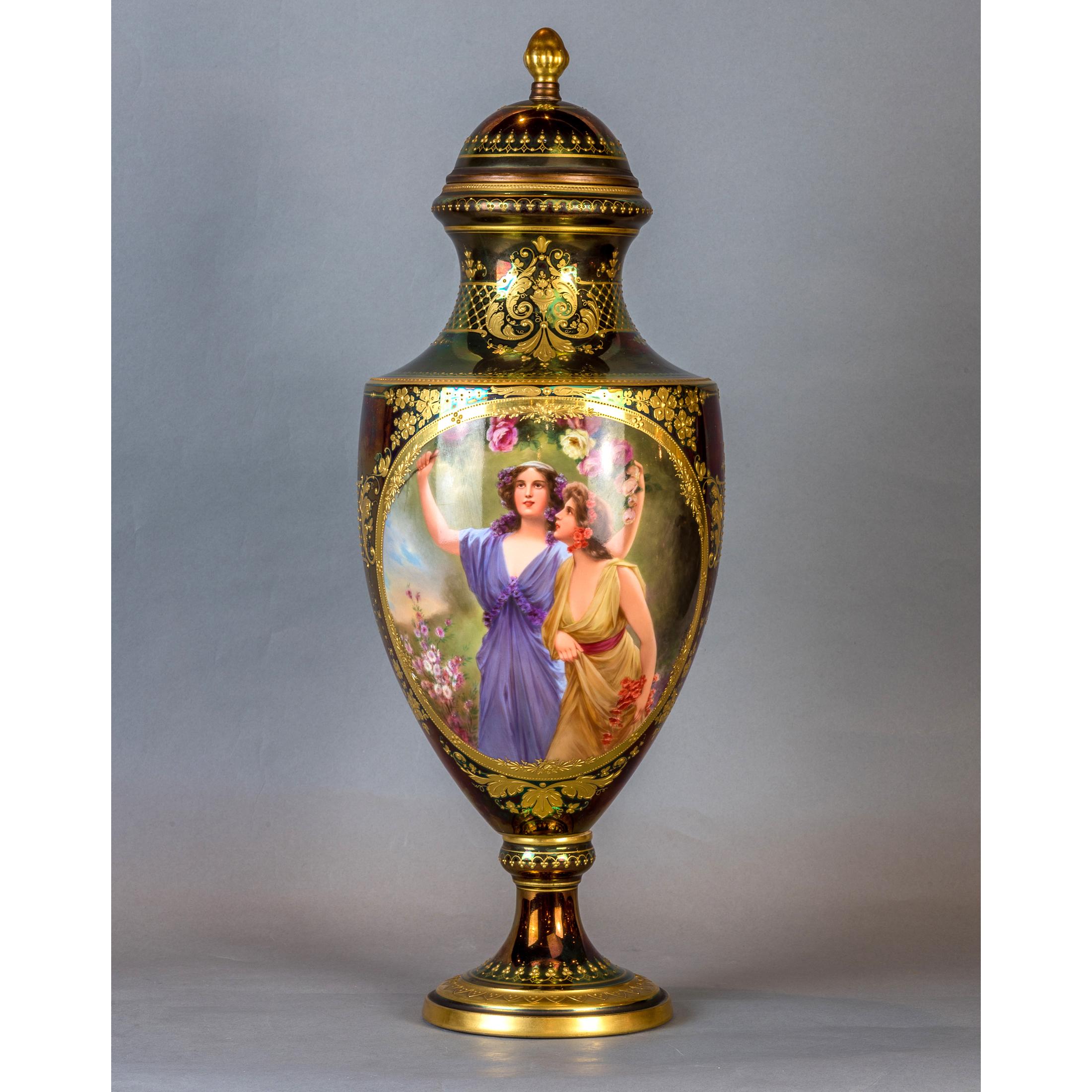 A Fine Royal Vienna gilt-decorated jeweled iridescent portrait porcelain covered urn

Signed Wagner 
Origin: Austria 
Date: circa 1900 
Dimension: 20 1/2 in. x 8 in.