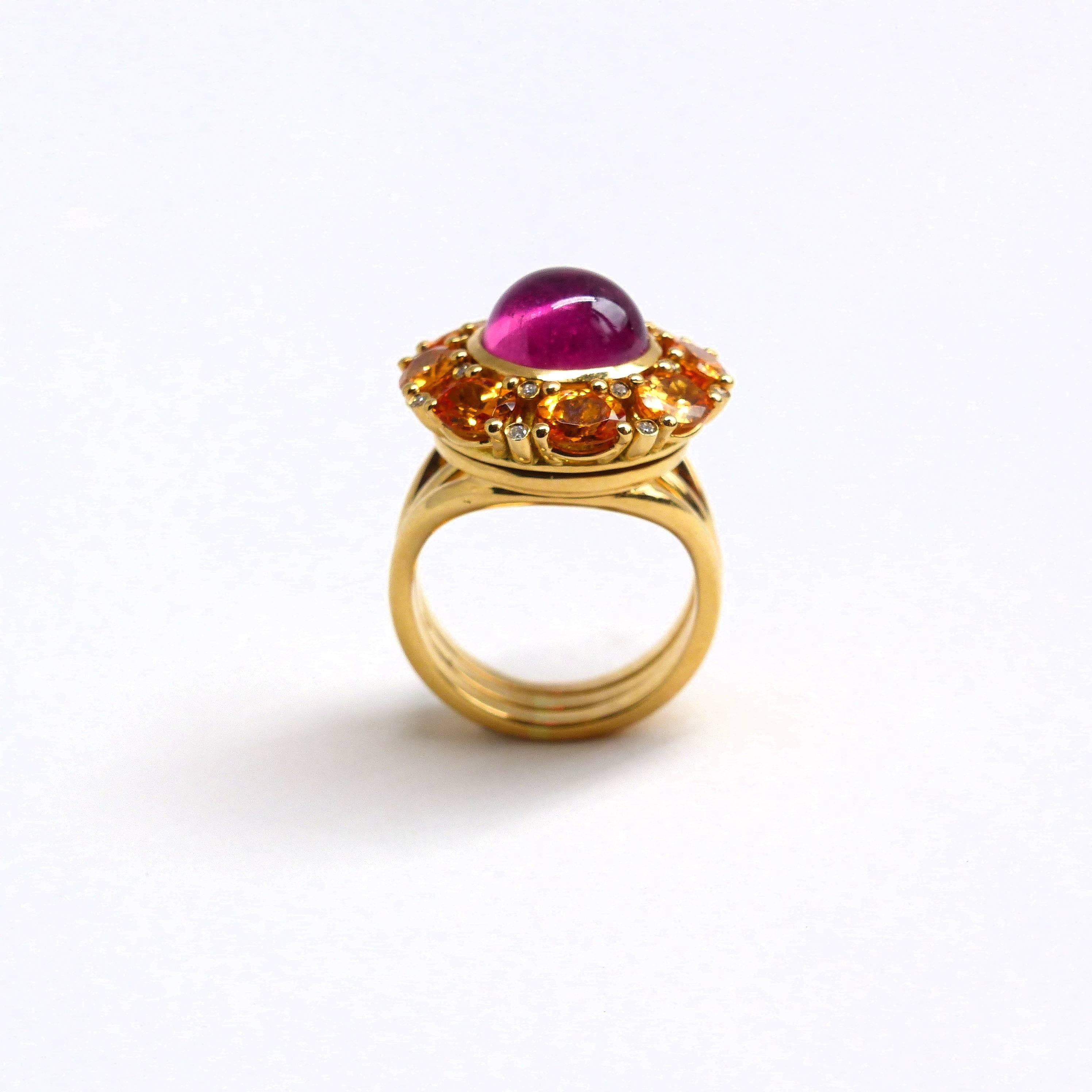 Thomas Leyser is renowned for his contemporary jewellery designs utilizing fine gemstones. 

This 18k rose gold ring (19.38g) is set with 1x Rubellite Cabouchon (round, 10mm, 4.60ct) and 8x Mandarin Garnets (facetted, oval, 5x4mm, 3.52ct) + 16x