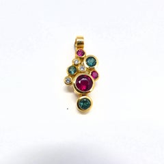 Pendant in Rose Gold with green Tourmalines and Rubelites and Diamonds.