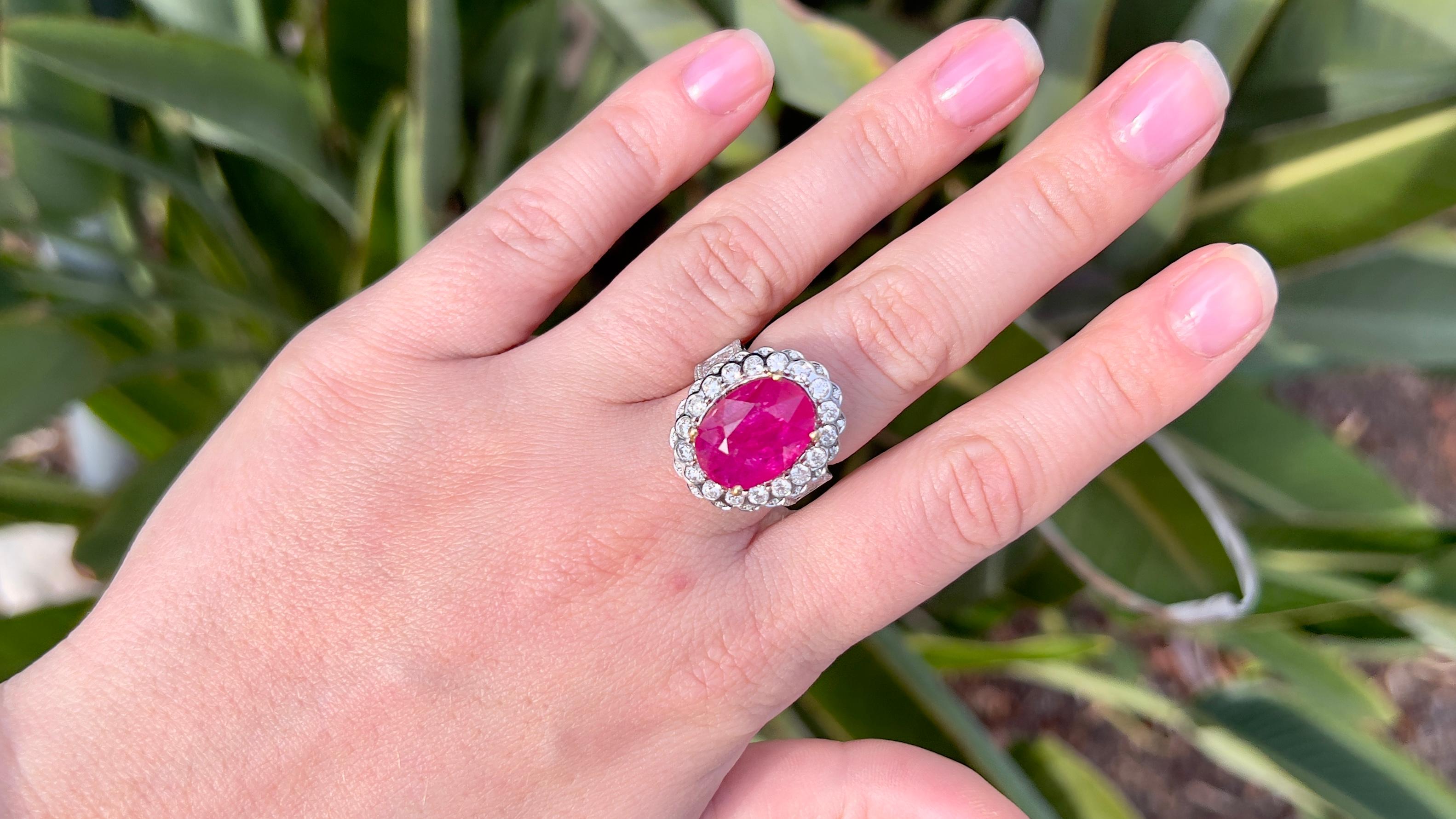Fine Ruby = 7.93 Carat 
Cut: Oval
Diamonds = 1.90 Carats
( Color: F, Clarity: VS )
Metal: 18K Gold
Ring Size: 6.75* US
*It can be resized complimentary