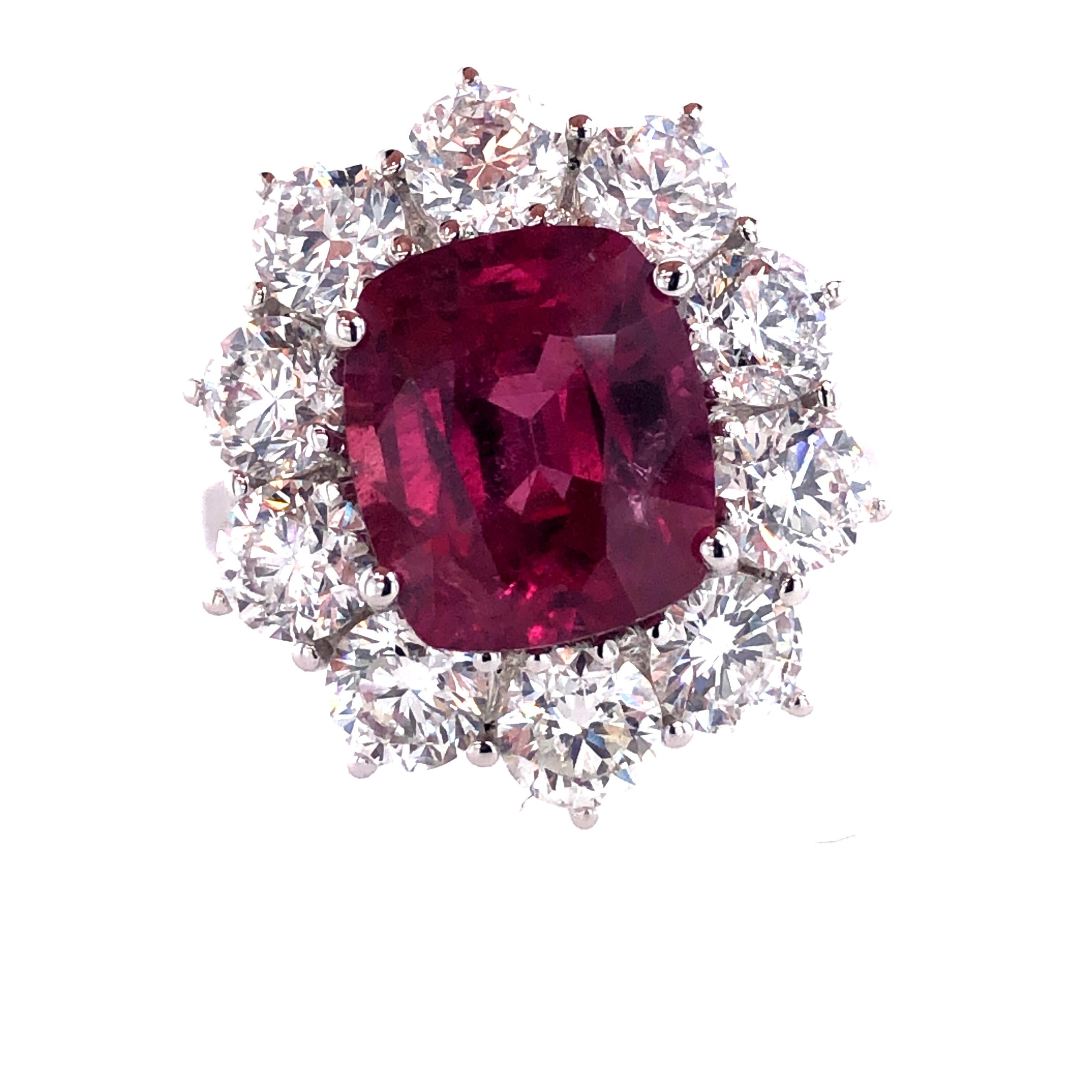 Offered here is a dazzling Ruby weighing 4.61 carats showcases its rich red color in this 18 kt white gold princess Diana Style ring. 
Framed with 10 natural earth mined excellent quality round diamonds weighing 2.95 carats total, averaging G-H in