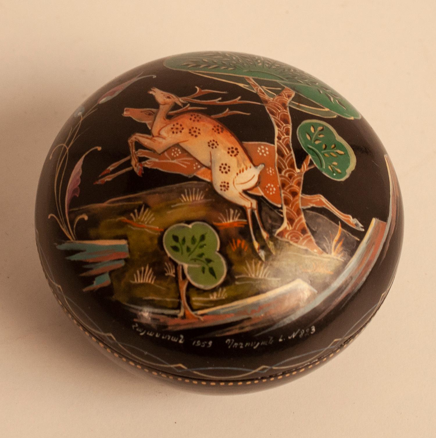 This is a very finely hand painted lidded lacquered box made in Russia, fully signed and dated 1959 which we attribute to the Palekh region workshop.
  