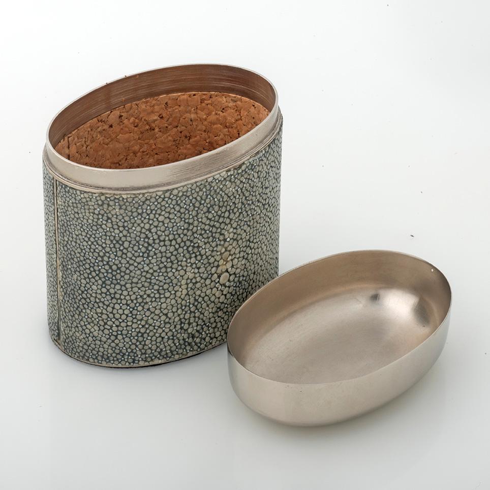 Luxury smoking accessory for a timeless home that become part of their surroundings and everyday actions, communicating stylistic elegance through a combination of precious shagreen leather distinctive design prespective.
Fashioned of polished