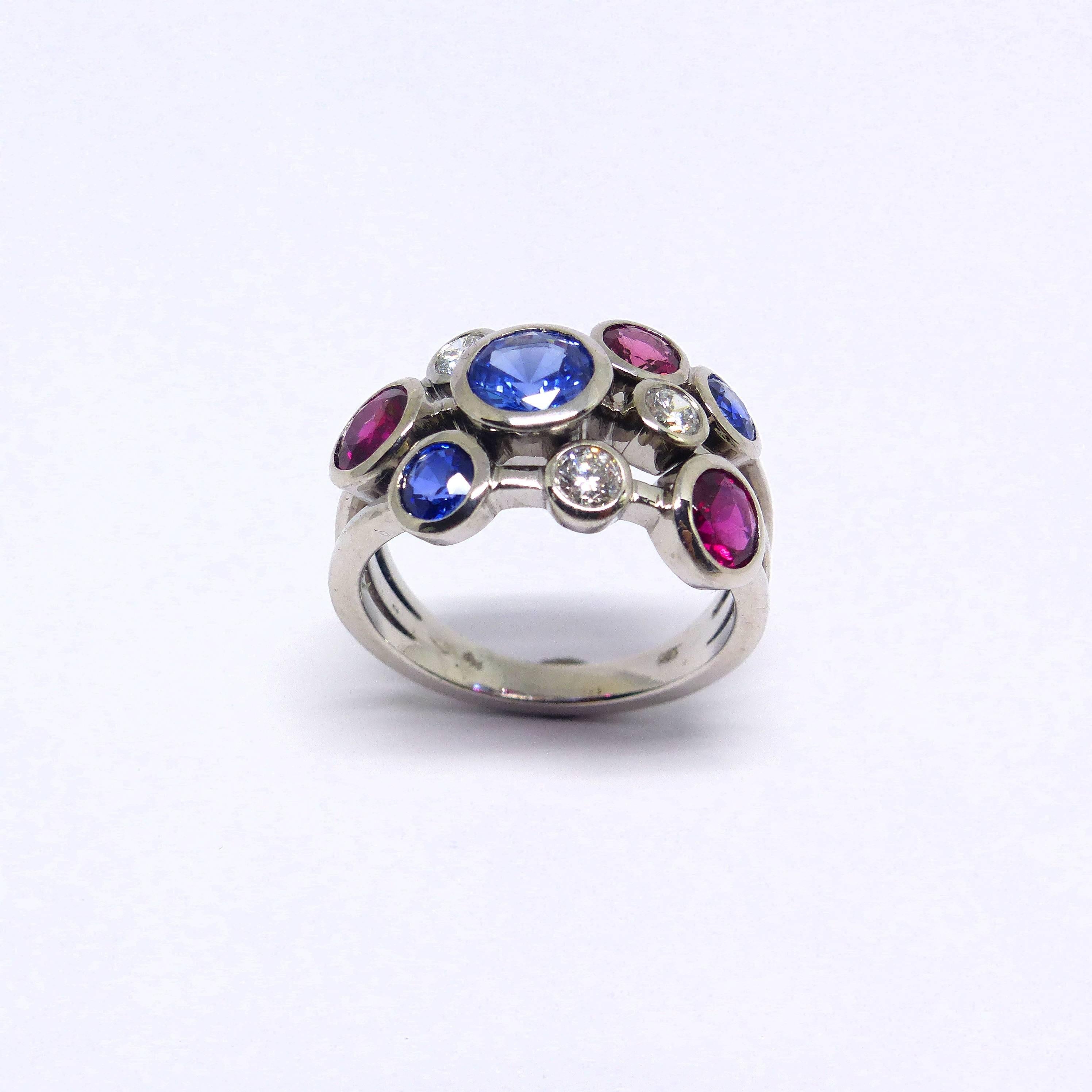 Contemporary Ring in White Gold with Sapphires and Rubelites and Diamonds. For Sale