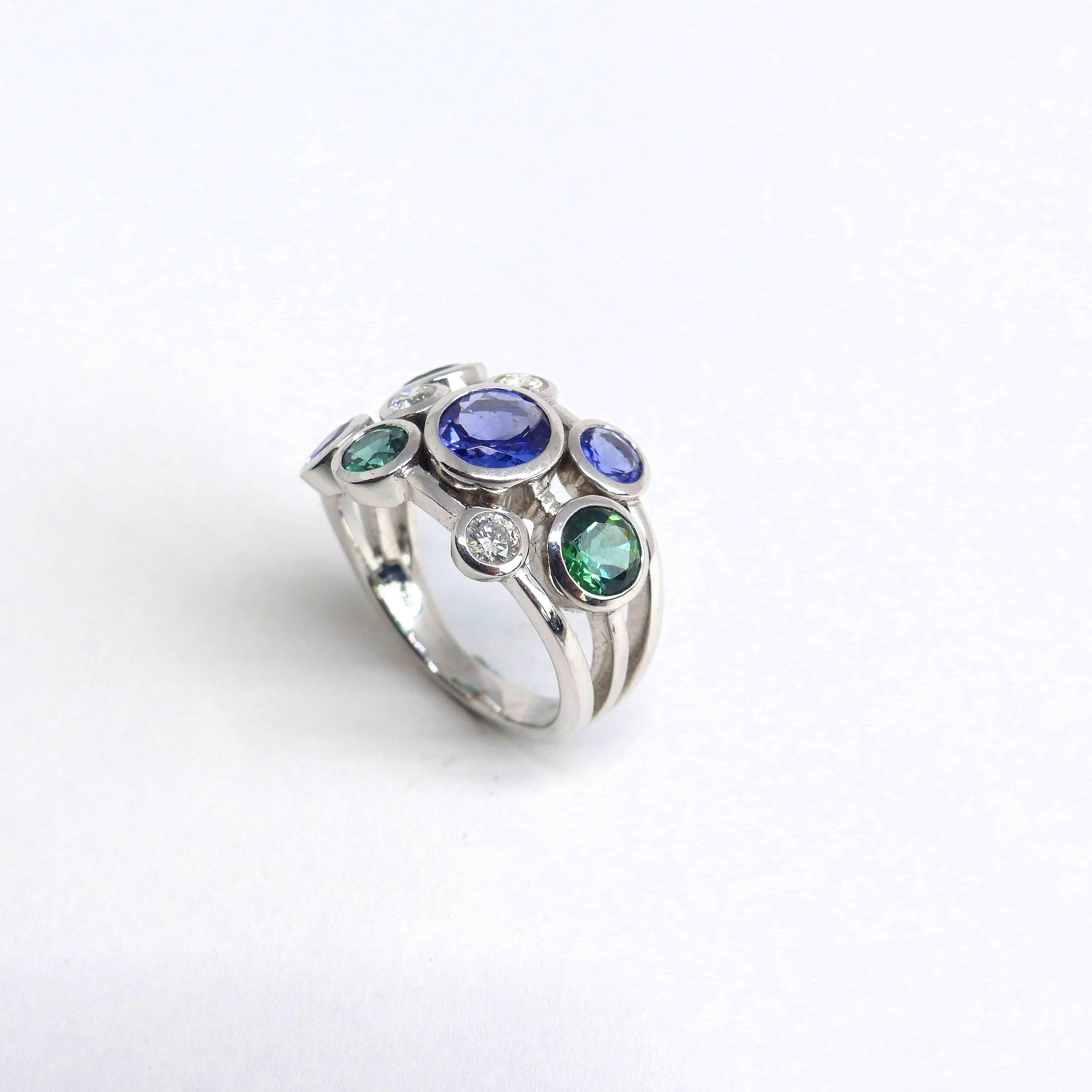 Thomas Leyser is renowned for his contemporary jewellery designs utilizing fine gemstones. 

This 18k white gold (9.39g) ring is set with 3x fine Sapphires (round, 4-6mm, 2.98ct) + 3x fine Tourmalines (4-5mm, 1.26ct) + 3x Diamonds (brillant-cut,
