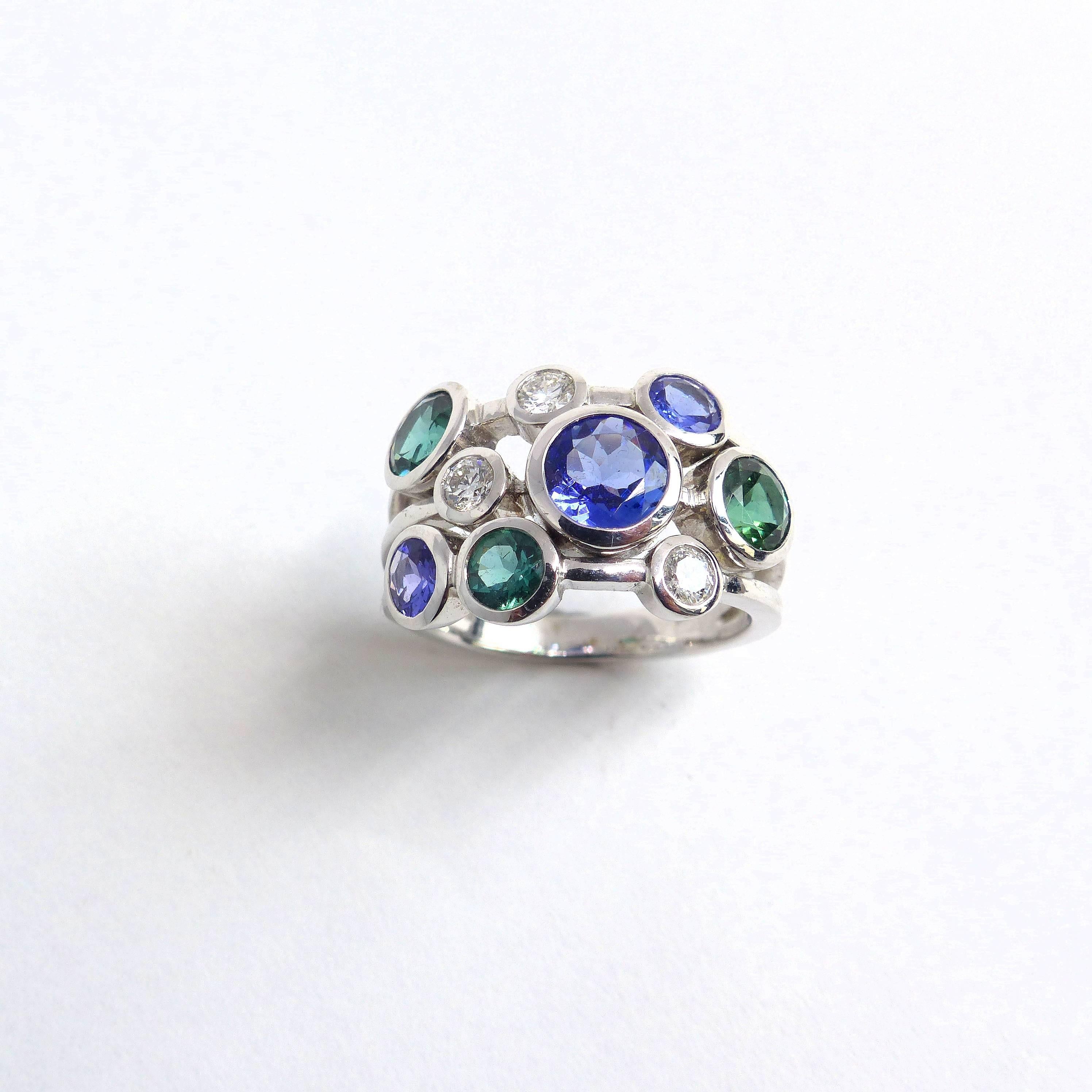 Contemporary Ring in White Gold with Sapphires and Tourmalines and Diamonds. For Sale