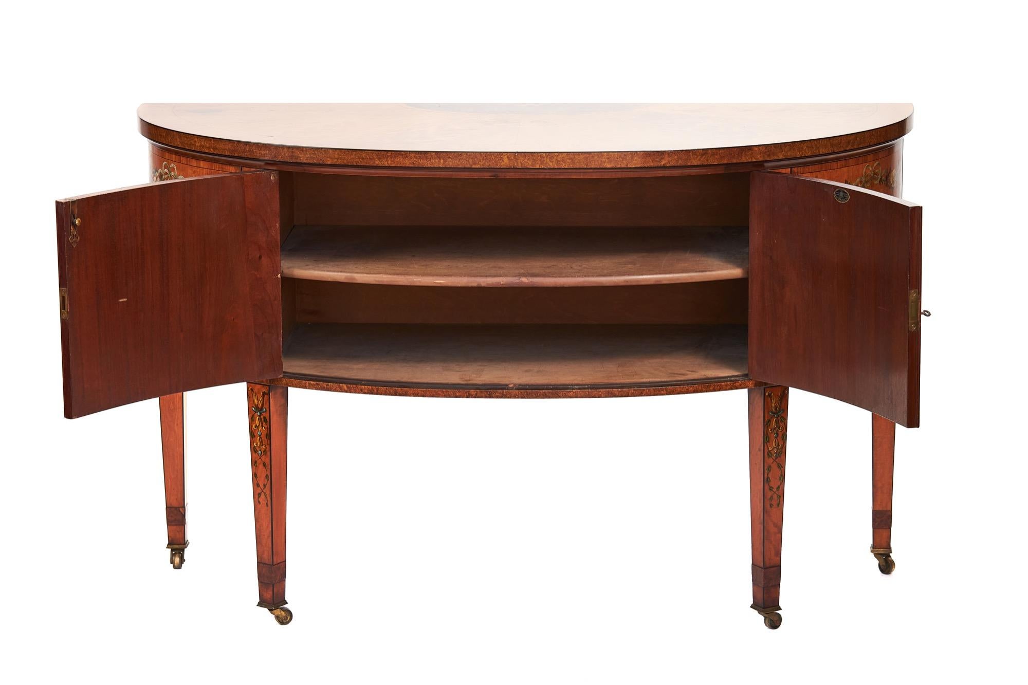 Fine Satinwood inlaid & Painted 2 door Demi Lune Commode by Maple & Co
circa 1900
Segmented Satinwood , Burr Walnut & Tulip banding Sunburst top with cross banding,
Two door cupboard base , open to reveal single shelf interior,
sitting on 4 tapering