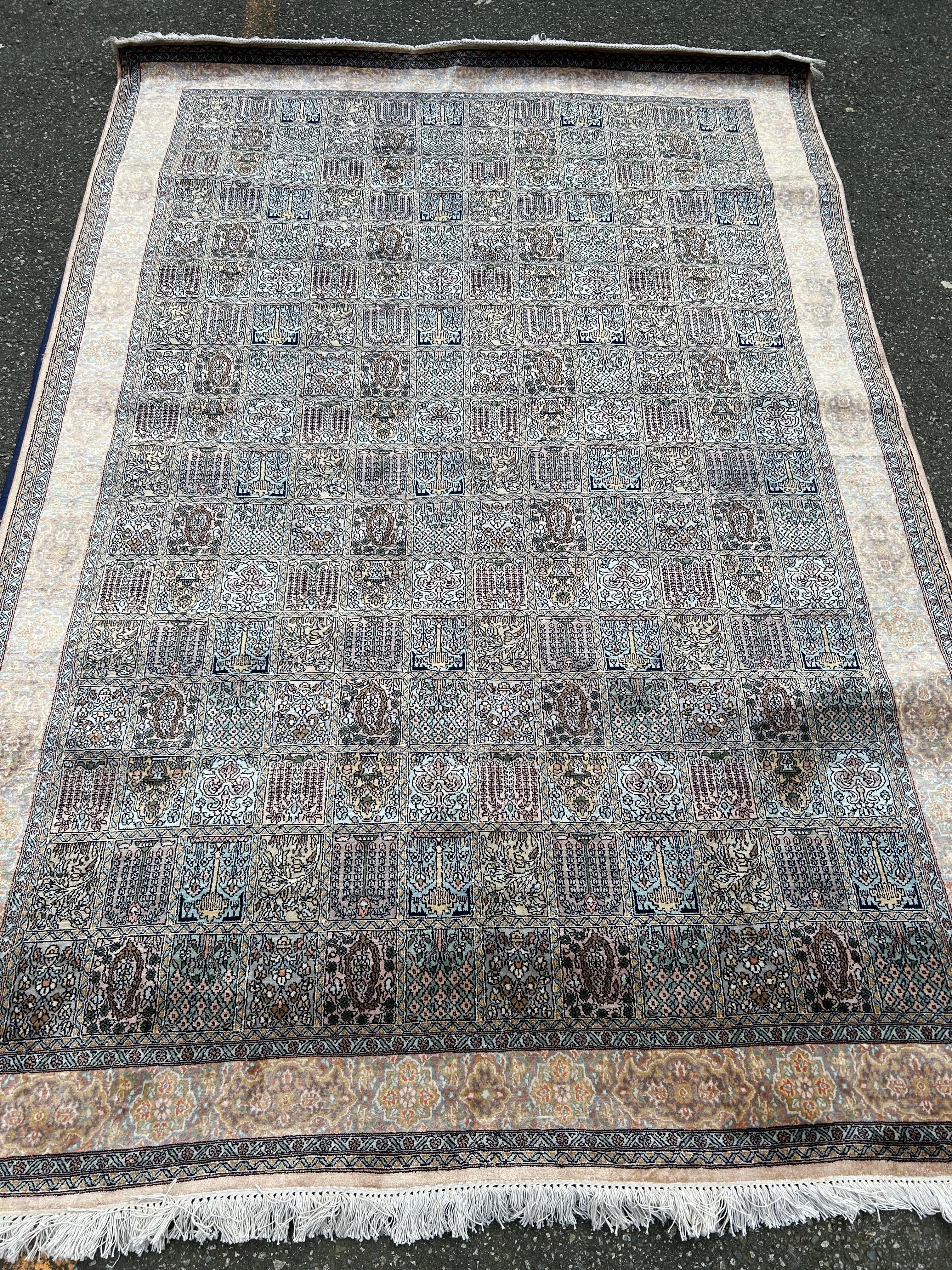 Old stock hard to source Mulberry silk rug from Kashmir with exquisite a refined muted palette. Gardens into Paradise motif with beautiful contrasts. This is a rare carpet that is in excellent condition. A rug worth incorporating as the ongoing