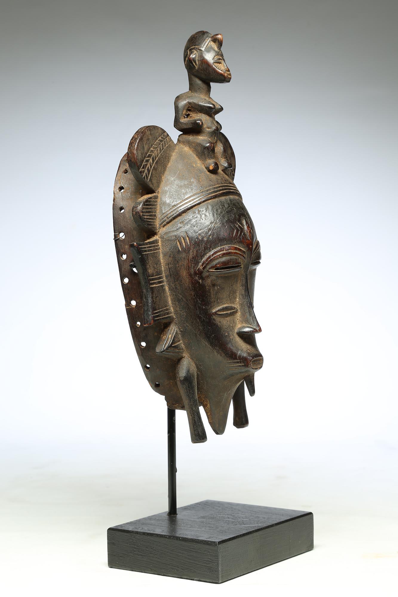 Ivorian Fine Senufo Kepelie Dance Mask with Female Figure on Top, Early 20th Century