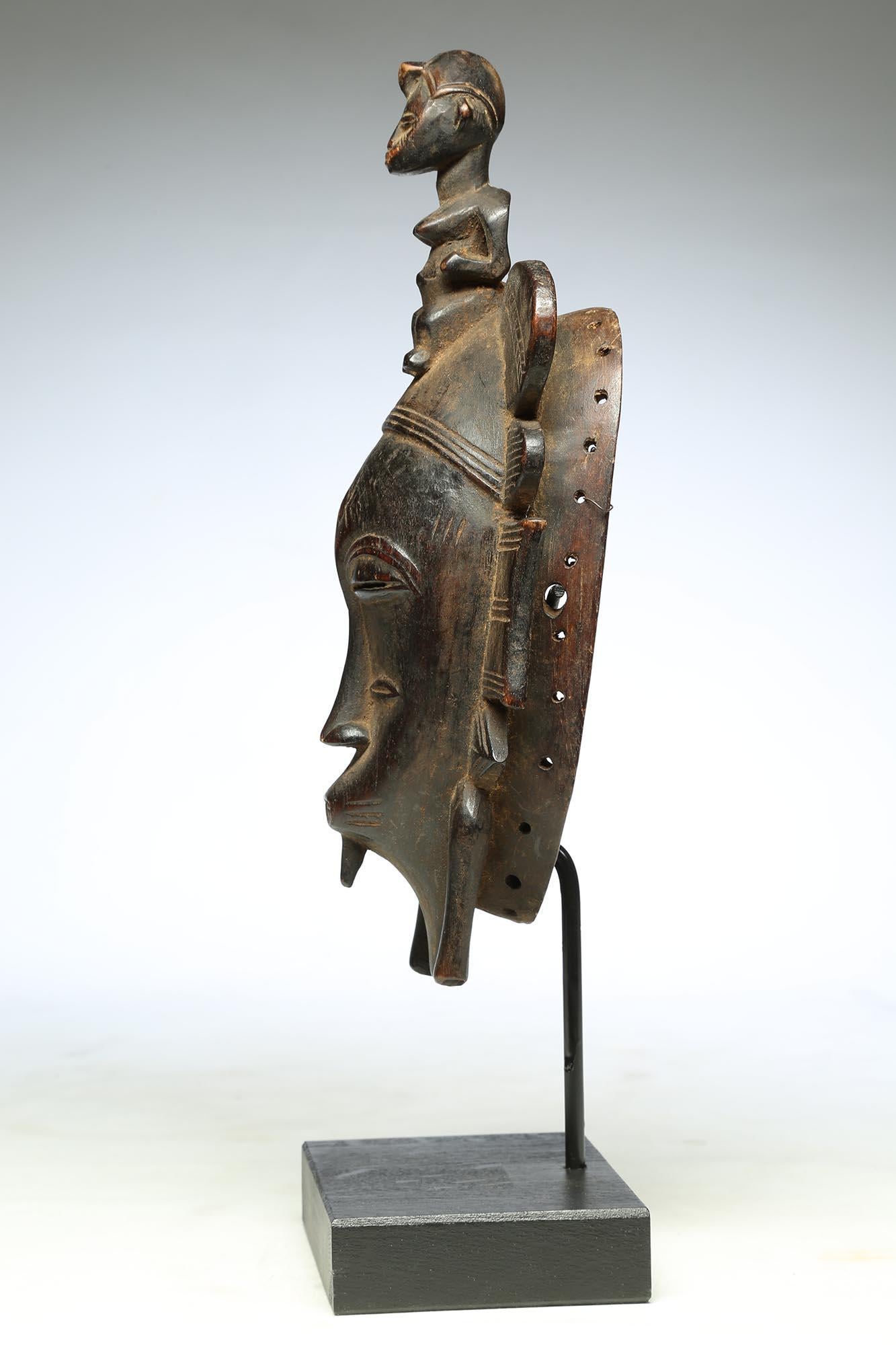 Wood Fine Senufo Kepelie Dance Mask with Female Figure on Top, Early 20th Century