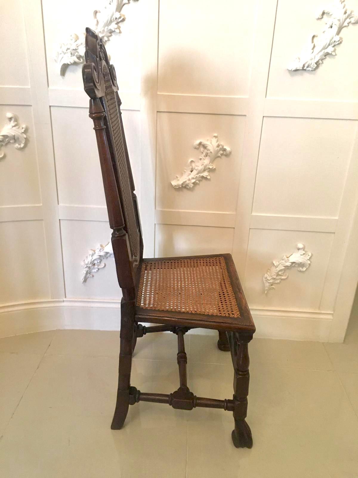 Fine set of 10 antique carved oak Carolean style chairs consisting of 2 carvers and 8 single chairs having a fantastic shaped carved top rail, bergere shaped carved paneled back and turned oak uprights. The carvers having attractive shaped open arms