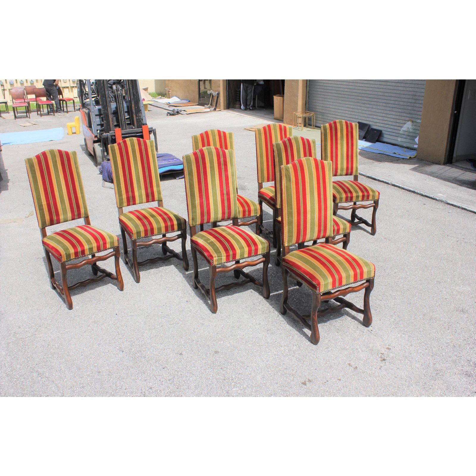 Fine set of 8 Louis XIII style Os de Mouton dining chairs with chapeau de gendarme backs, circa 1900th century. Vintage fabric upholstery with nail heads, solid walnut chair frames are in excellent condition. From South France Bordeaux. ( fabric