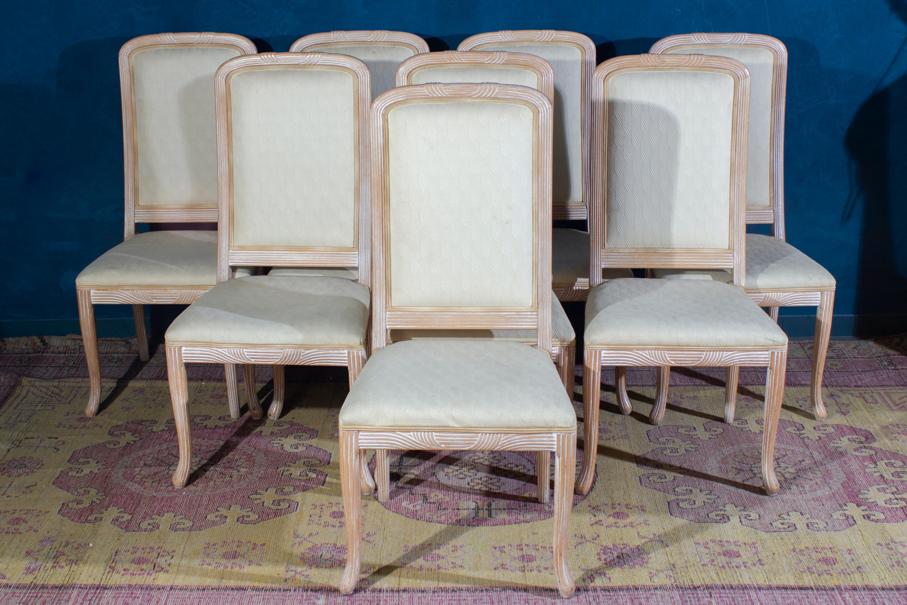 Set of eight Italian white decapè wood chairs with white upholstery seats.
Made in Italy 1970'. The wood is in perfect vintage condition. The upholstery is in very good condition only with the wear of time. 
Each chair has been masterfully