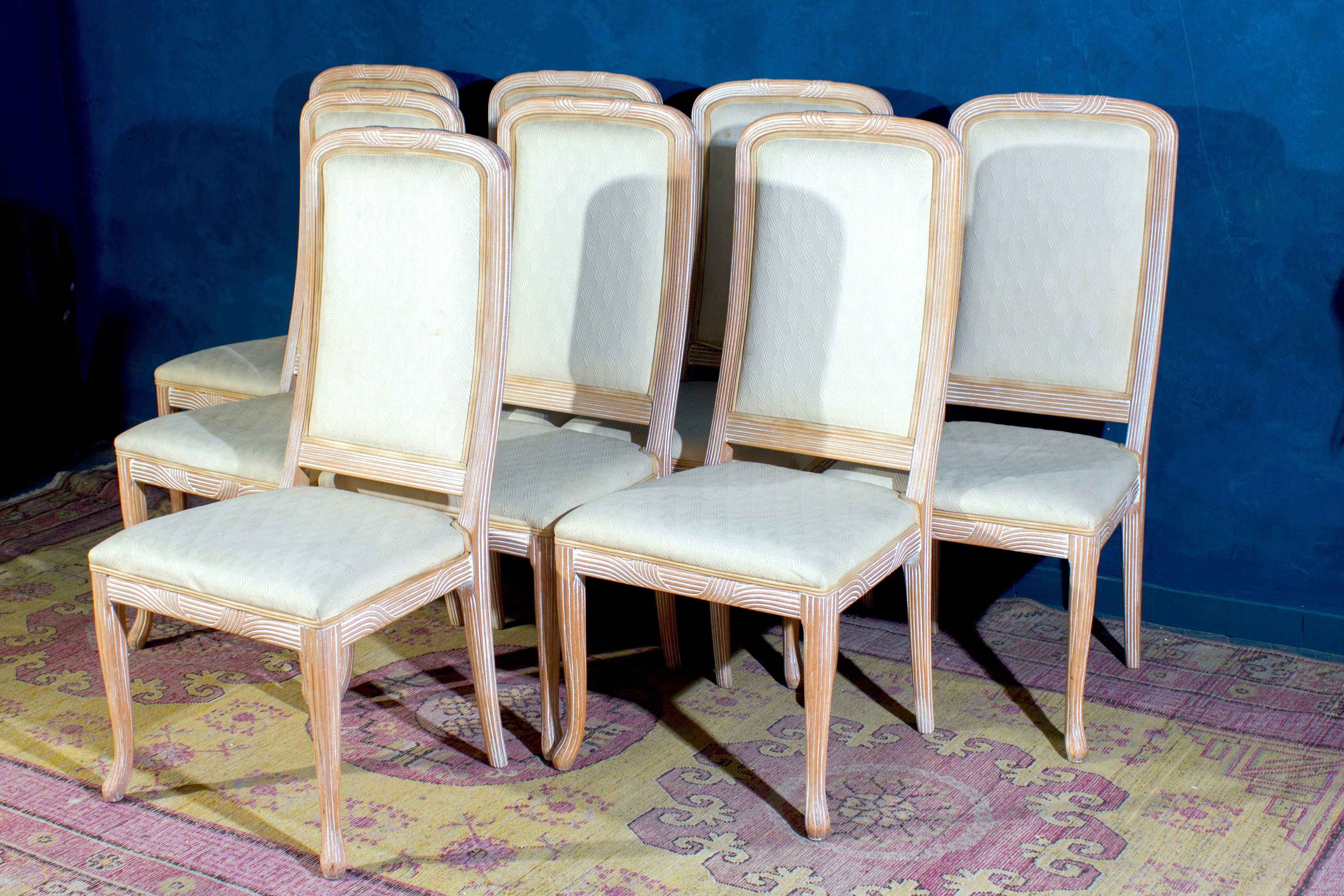 Set of eight Italian white decapè wood chairs with white upholstery seats.
Made in Italy 1970'. The wood is in perfect vintage condition. The upholstery is in very good condition only with the wear of time. 
Each chair has been masterfully crafted,