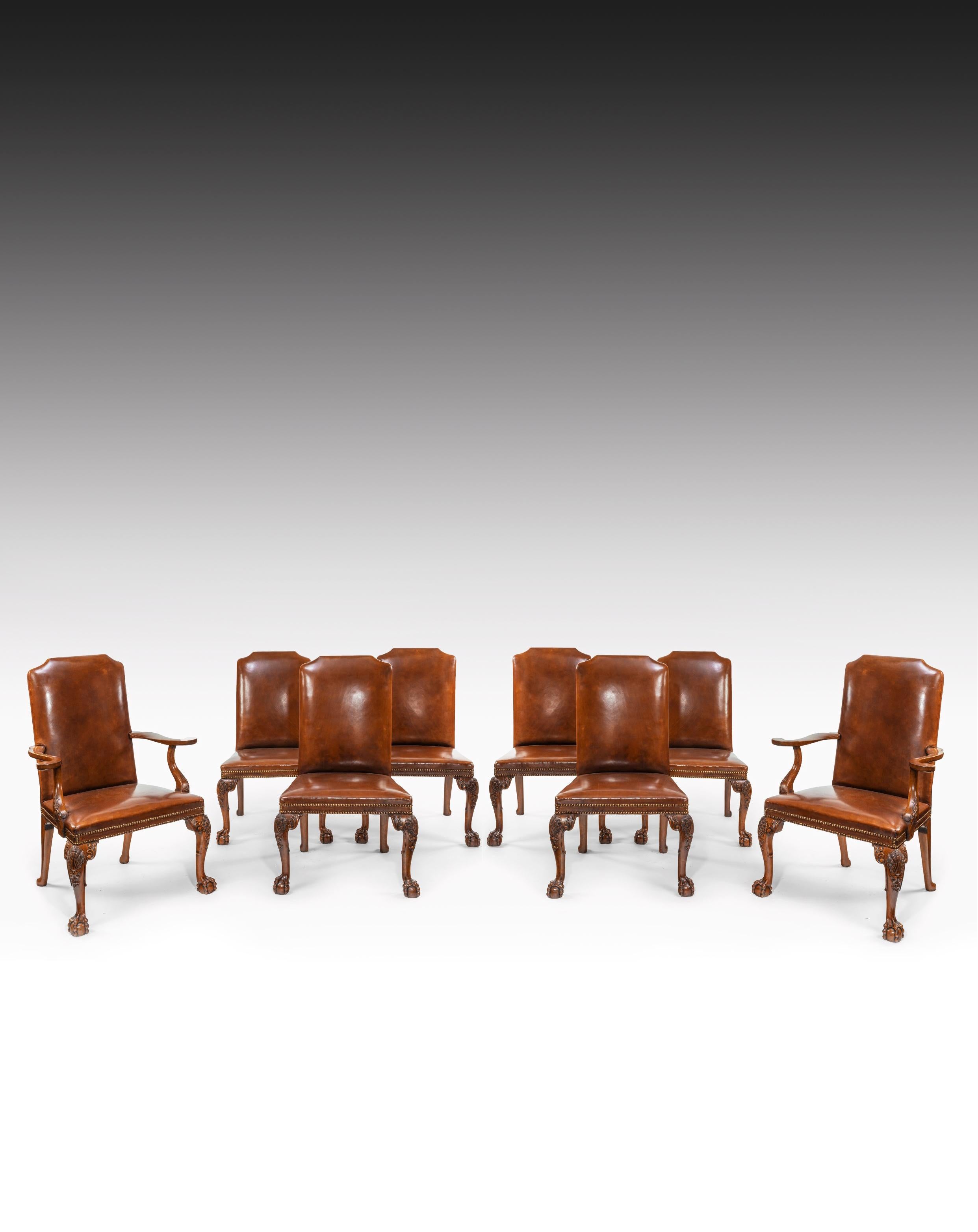 A fine quality set of eight carved walnut cabriole legged leather upholstered dining chairs, in the Queen Anne style, consisting of two carvers and six single chairs.

English, circa 1910.


Of generous proportions, the rectangular shaped