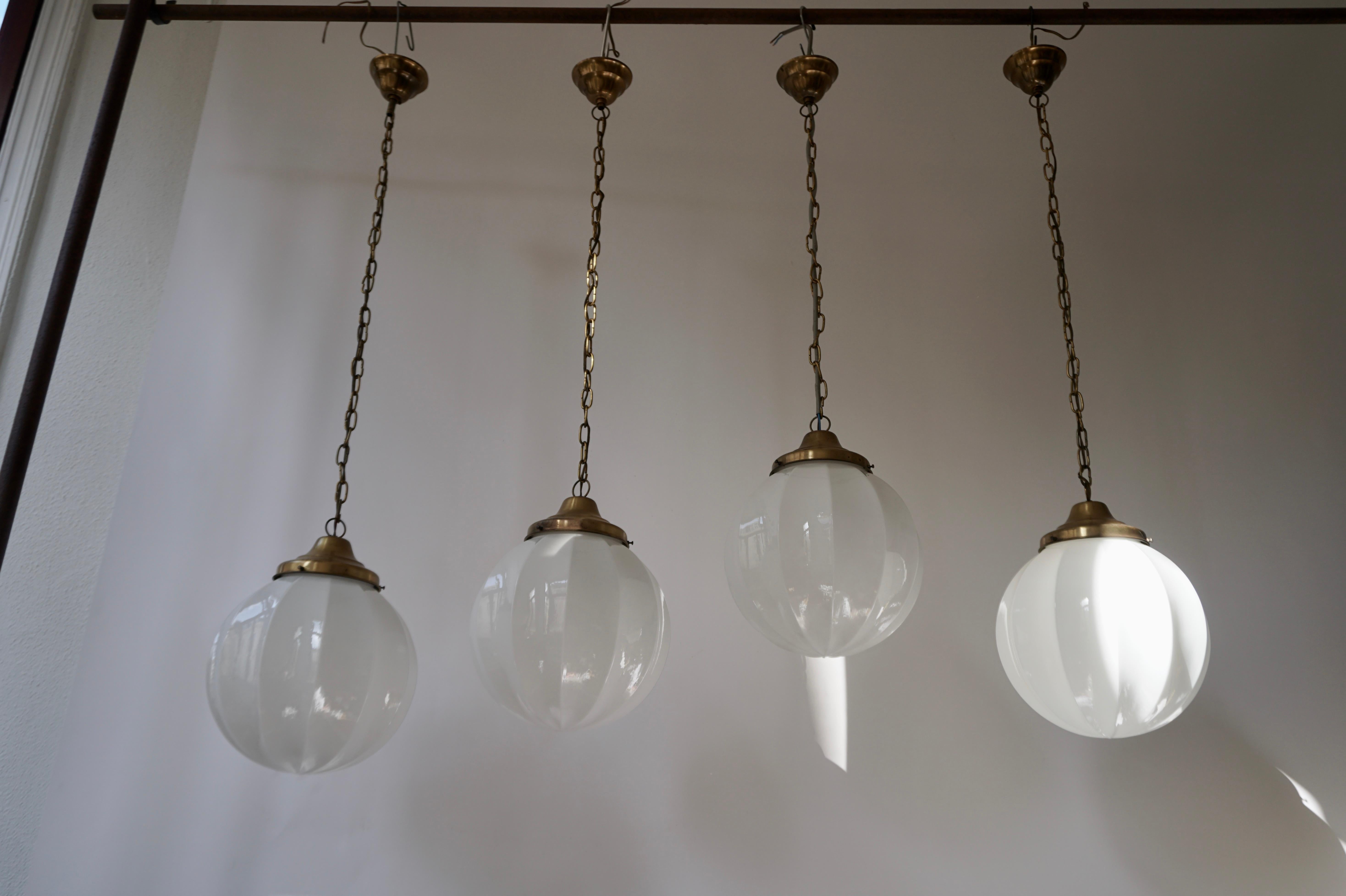 Beautiful set of four opaline glass pendants with brass hardware.
Diameter 28 cm.
Total height included with the chain and canopy 100 cm.
Price per item.