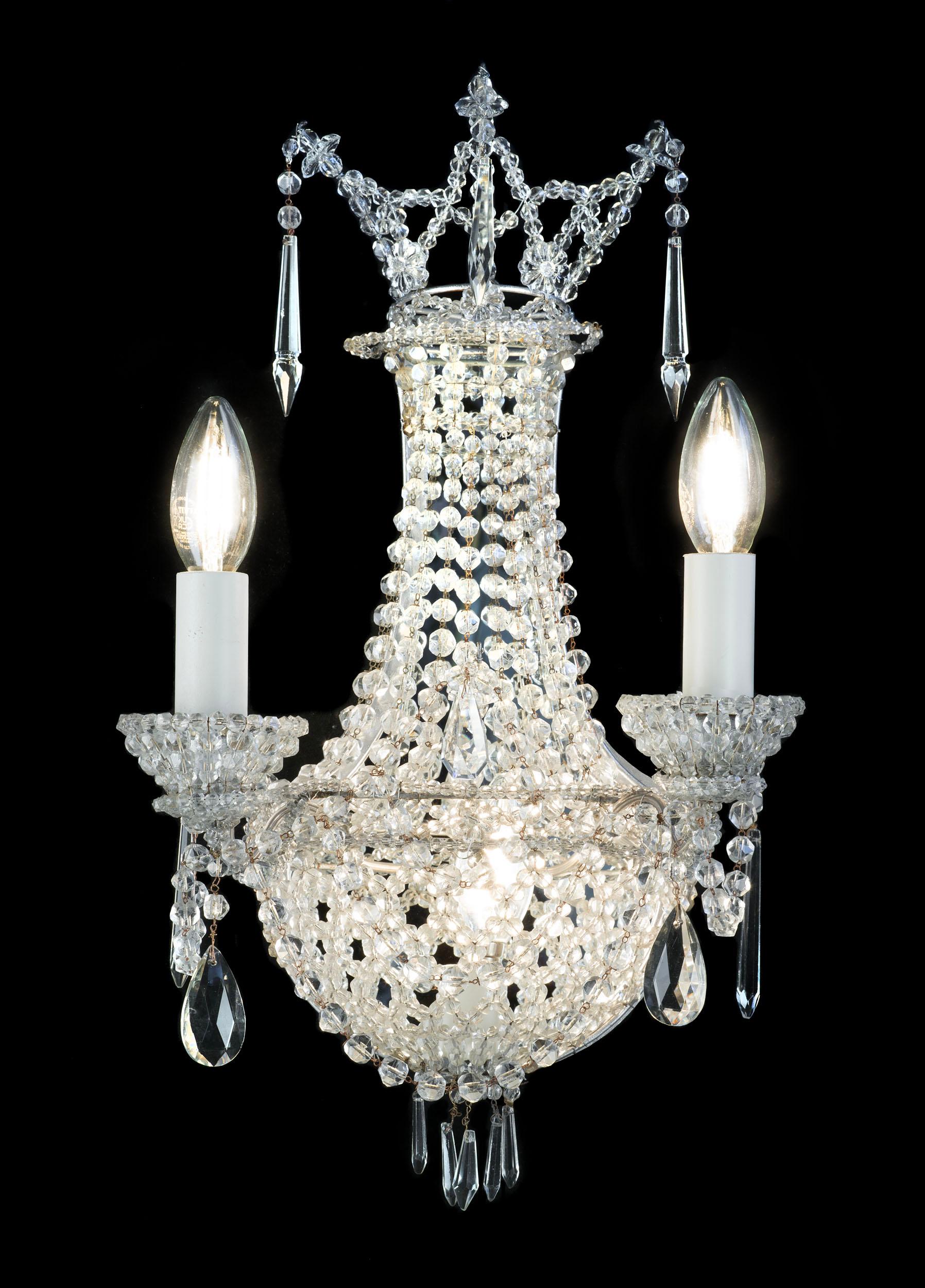A rare set of four Montgolfier style antique glass girandoles, each with twin candle arms and mirrored backs, strung with beads and lustres.

English, c.1900.