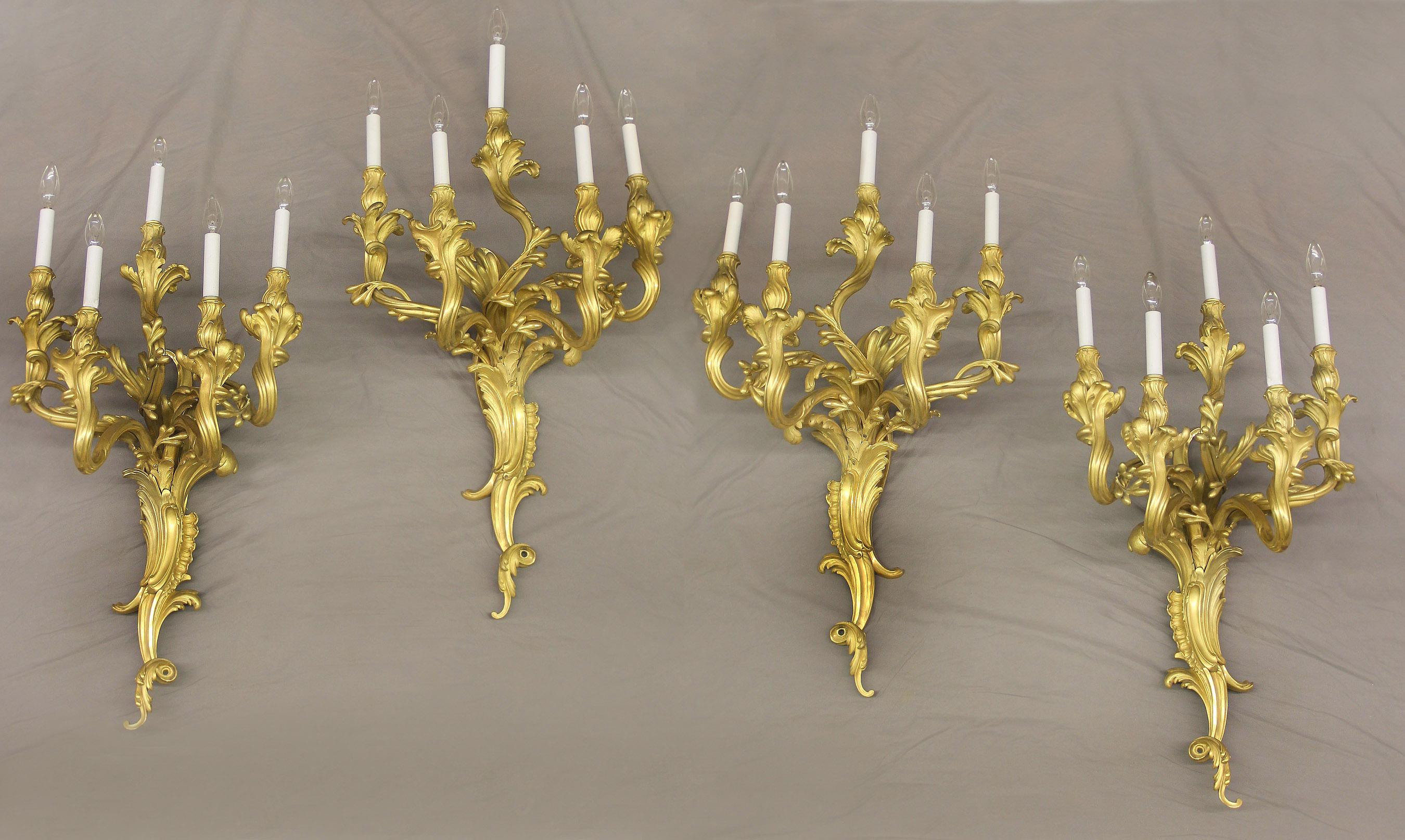 A very fine set of four early 20th century gilt bronze five light sconces By Caldwell

Edward F. Caldwell and Co. Inc. New York

The beautiful foliate-scolled backplate supporting five tiered, great quality chiseled acanthus candle branches,