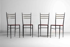 Fine set of metal dining chairs with red leather seating, Italy 1970s