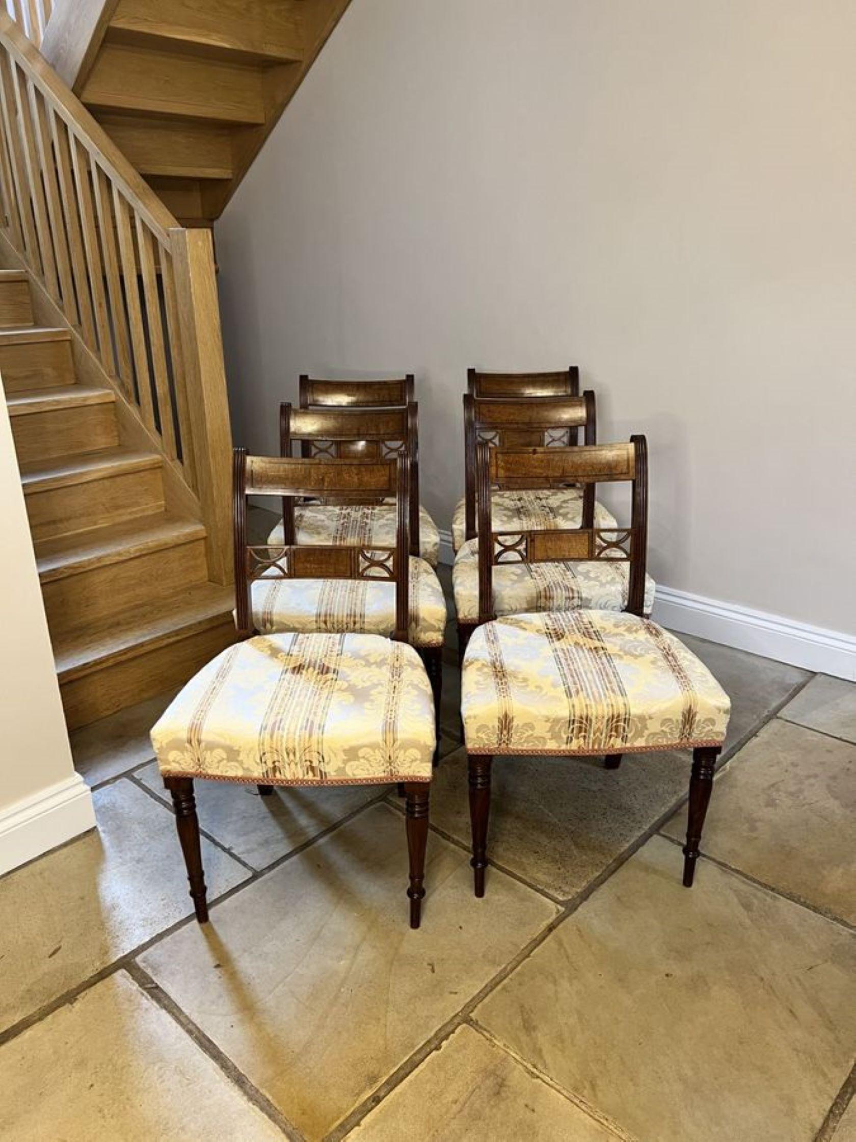 Fine set of six antique George III quality mahogany dining chairs having a quality figured mahogany back with reeded supports, upholstered stuff over seats, standing on elegant turned tapering legs to the front and out swept legs to the back.

D.