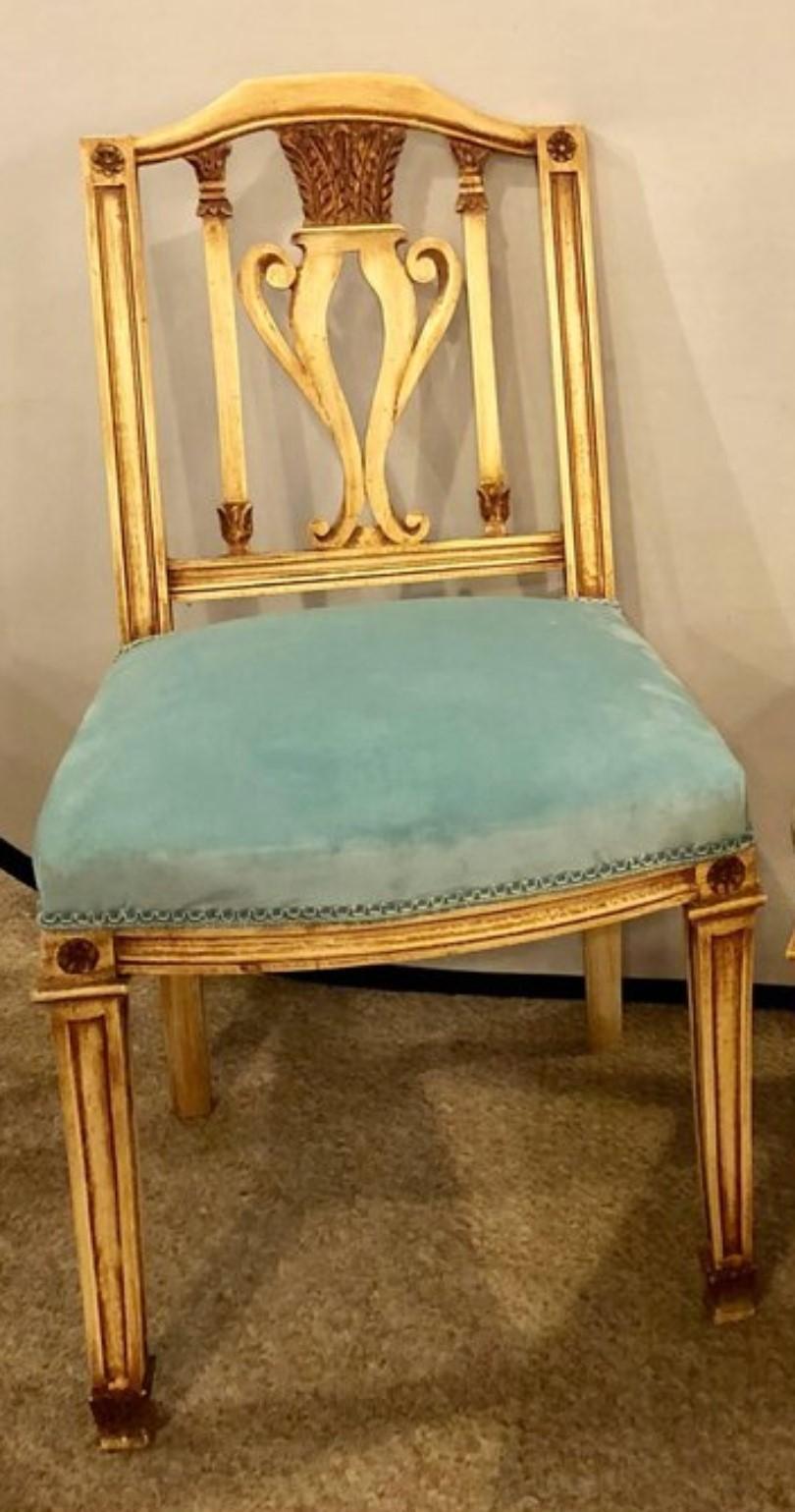 A set of six Regency style dining chairs comprising all new turquoise seat covers. Painted dining chairs in manner of Maison Jansen. Each of these strong and sturdy dining chairs are finished in a painted and parcel-gilt decorated design with newly