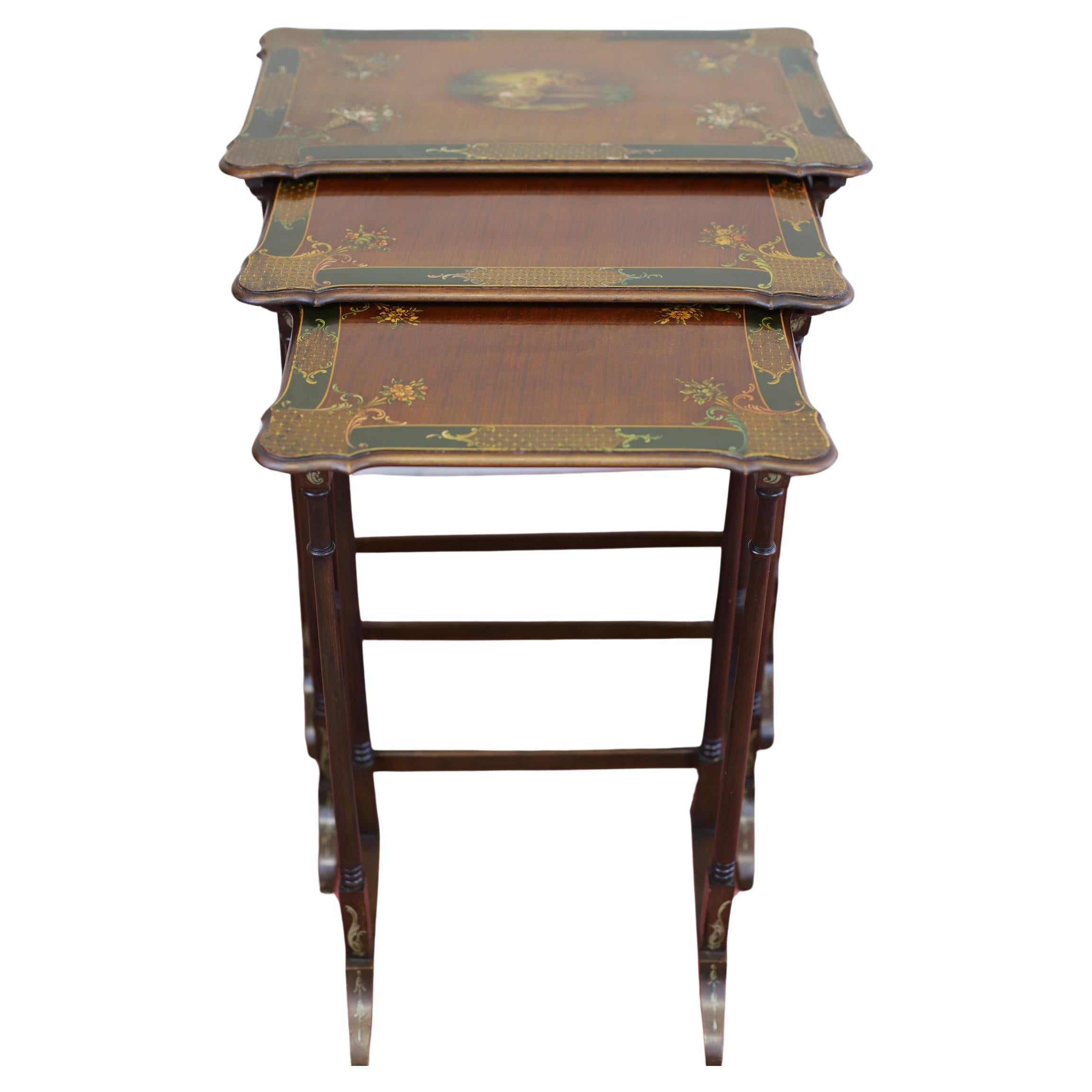 This is a beautiful set of three Victorian Mahogany hand-painted nesting tables. The tables are designed with a multicoloured finish and are perfect for antique enthusiasts. The tables are made from high-quality materials and each top finely painted
