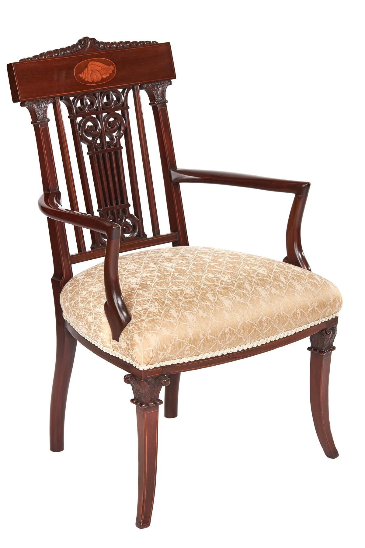 Fine Sheraton Revival Mahogany inlaid & carved Elbow chair,circa 1900

Top rail with  carved detail on top, oval inlay centre, & boxwood line inlay around edge,
Open pierced carved back splat, cross rail & support rails each side with Boxwood line