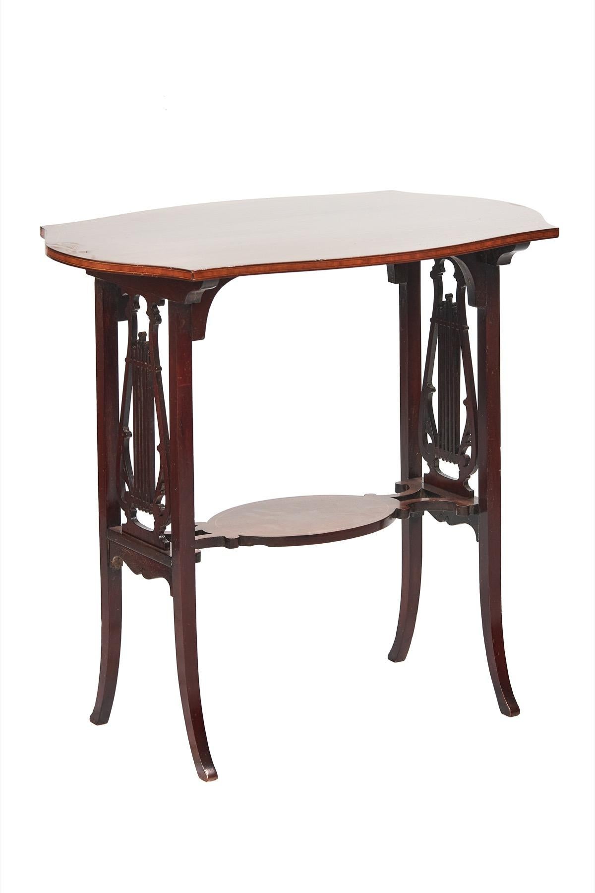 Fine Sheraton Revival Mahogany Inlaid & carved Lyre end support table
Circa 1900,
Shaped Rectangular top with Boxwood line inlay, Satinwood Banded inlay around edge,
Oval Shaped under tier with boxwood line inlay,
End supports with Lyre shaped open