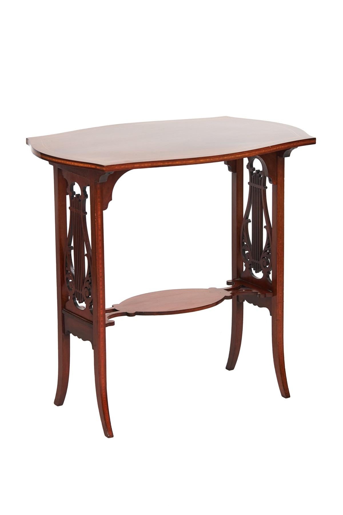 Fine Sheraton Revival Mahogany Inlaid & carved Lyre end support table
Circa 1900,
Shaped Rectangular top with Boxwood line inlay,
 Satinwood Banded inlay around edge,
Oval Shaped under tier with boxwood line inlay,
End supports with Lyre shaped open