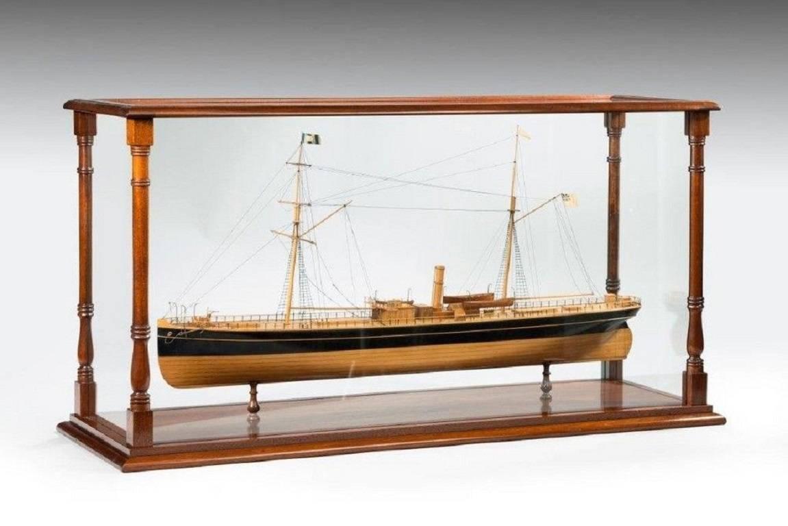 A fine shipyard model of an early sailing steam screw ship of the transitional sail to steam period with good detailed deck fittings including hatches, helm, windlass and ship's boats and masts and spars with rigging all set in a later mahogany case.