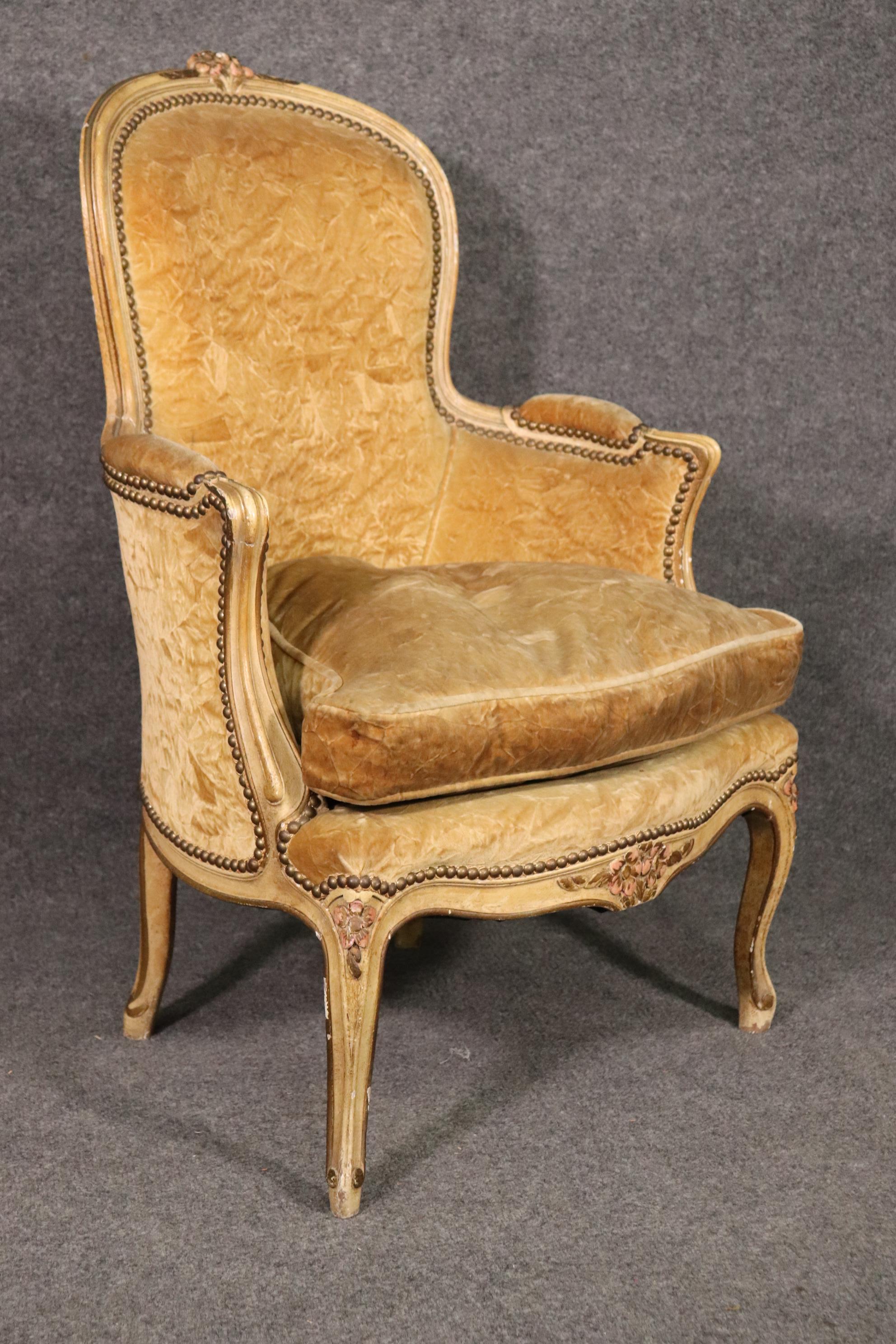 This is a superb signed Maison Jansen Bergere chair in a gold crushed velvet fabric. The size is a medium size and in very good condition. The chair has beautiful lines and even the upholstery is good for its age. The chair measures 37.5 tall x 26