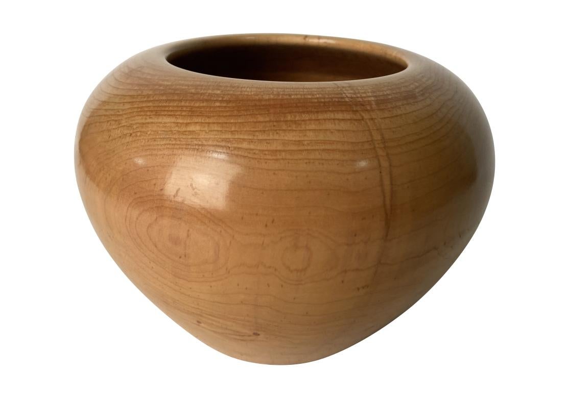 A very well crafted Turned Maple Bowl with good weight, a solid feel and fine plumbate form. Numbered 676, signed R. collier and dated 2005. The artist has utilized various growth marks, knots and inclusions to good affect adding interest. The