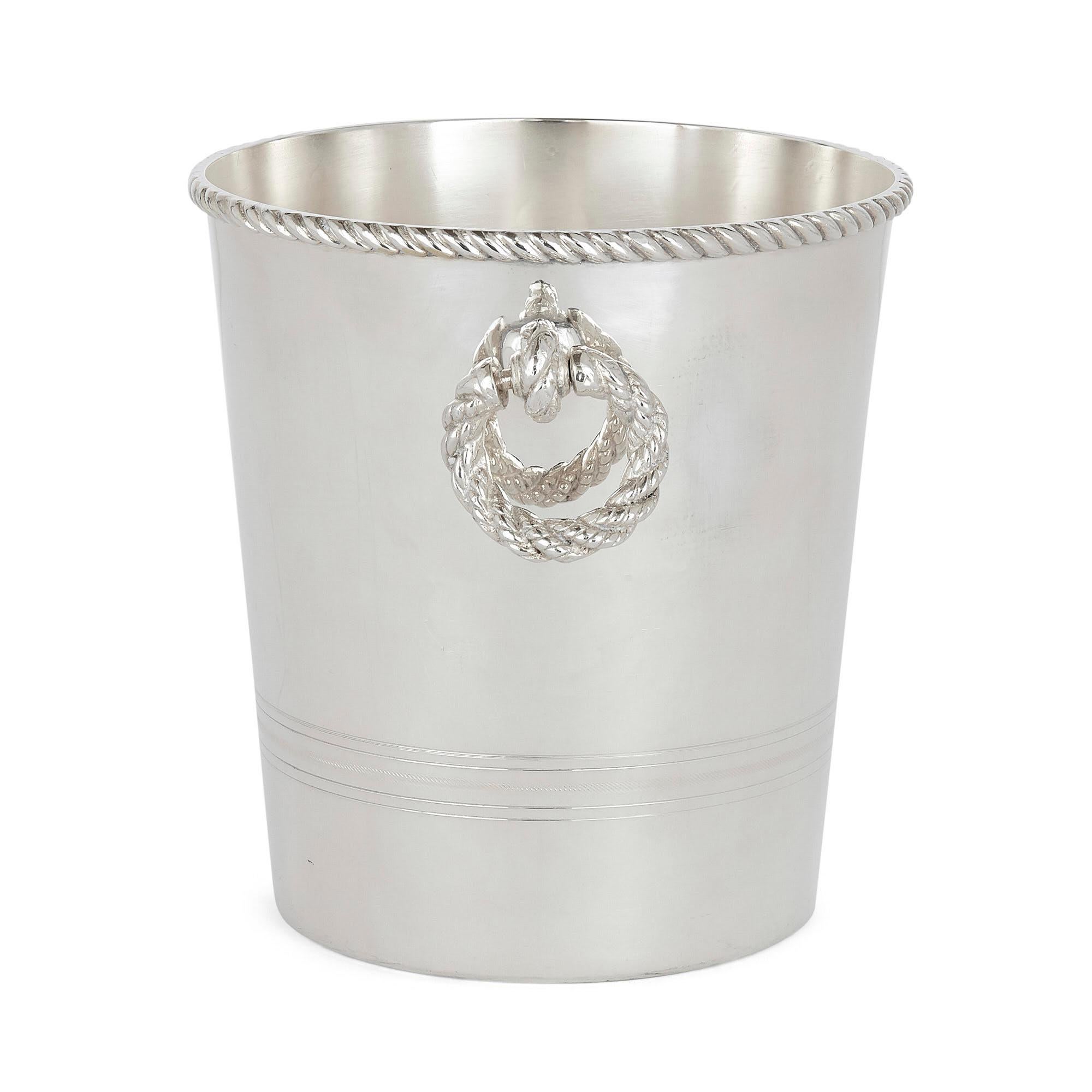 Fine silver-plate ice bucket by Lebanese Firm Habis
Lebanese, 20th century
Dimensions: Height 21cm, diameter 20cm

Featuring an elegant tapered cylindrical body, this fine ice bucket is crafted from silver-plate by Lebanese firm Habis. The
