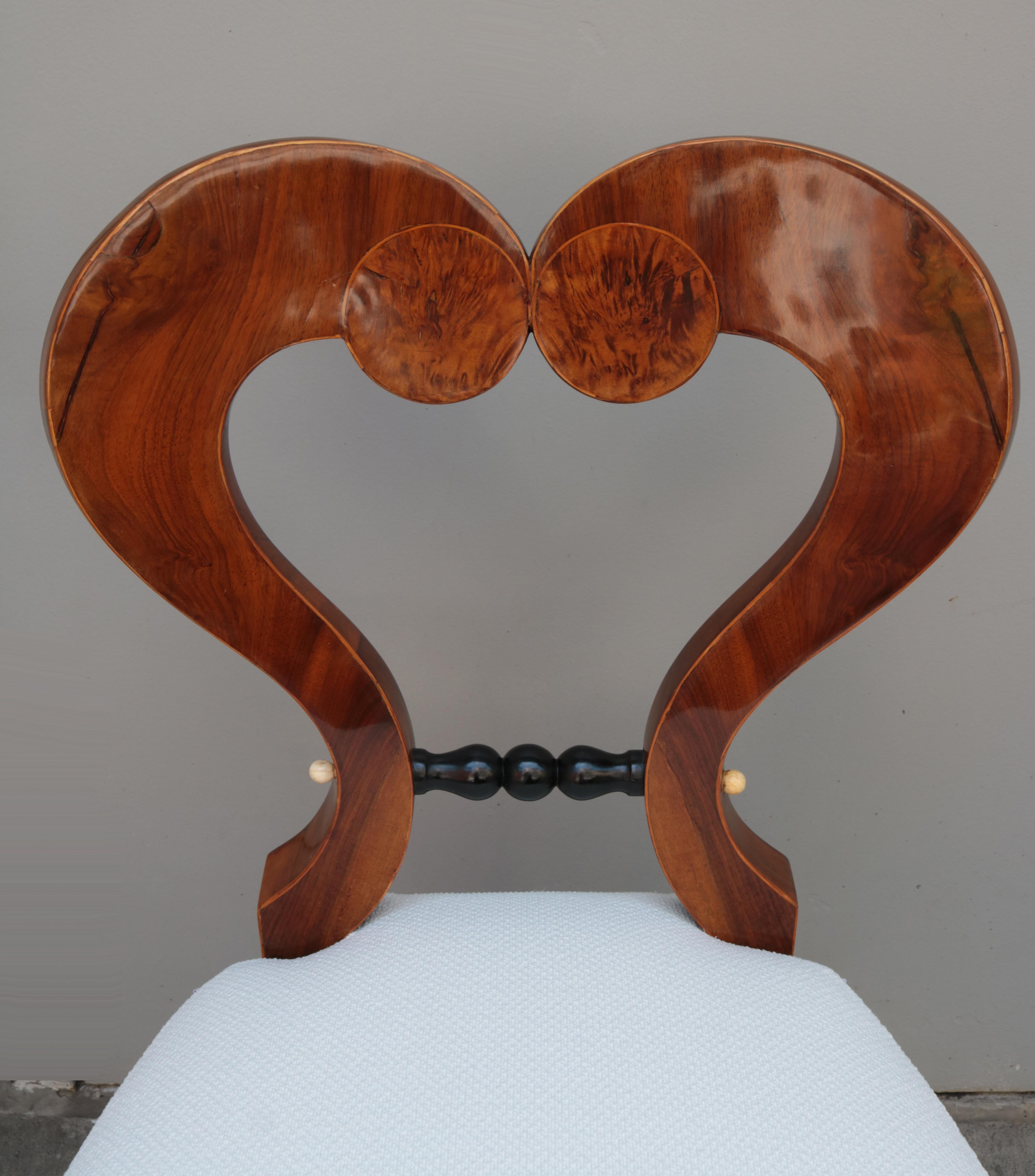 Fine Biedermeier side chair.
Walnut with walnut burl, ebonized accents 
and fruitwood inlays.
 