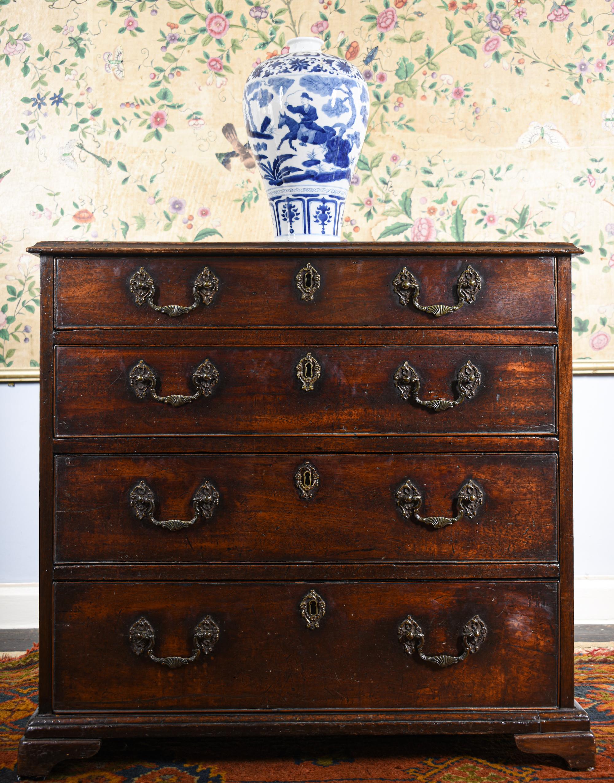 A fine quality small-sized Chippendale period Cuban mahogany chest of drawers. 
Late George II period, mid 18th century, circa 1760.

This is an exceptional antique (Georgian) example thanks to its 'commode' proportions, color, patina, small