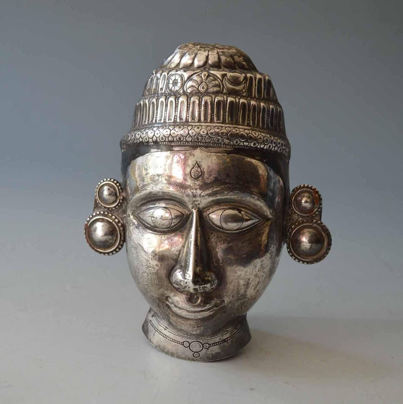 Fine South Indian Repousse Hindu god silver mask. 
Hand crafted repousse mask of a Hindu God probably with enamel Hair detail. 
The mask would have been made to used as a devotional object in the home or temple.
Weight 203 grams solid High