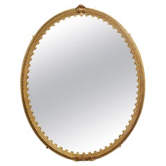 Splendido specchio ovale in legno dorato del XIX secolo