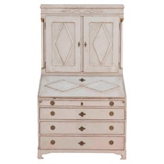 Fine Swedish three-part bureau with charming carvings and marble-painted columns