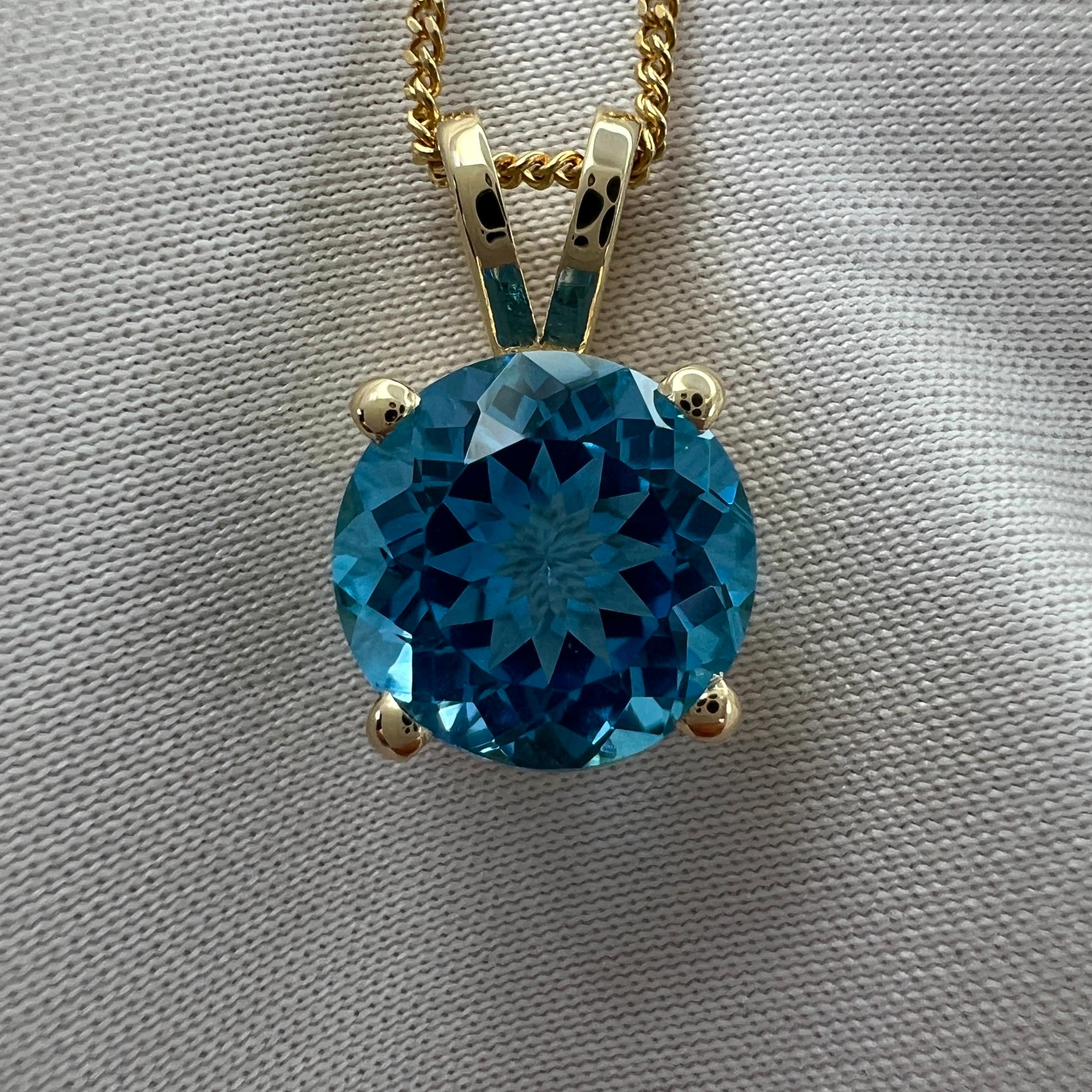 Fine Swiss Blue Topaz Round Cut Yellow Gold Solitaire Pendant Necklace.

Stunning blue topaz with a vivid 'Swiss' blue colour and excellent clarity, practically flawless.
Has an excellent round brilliant cut which shows lots of brightness and light