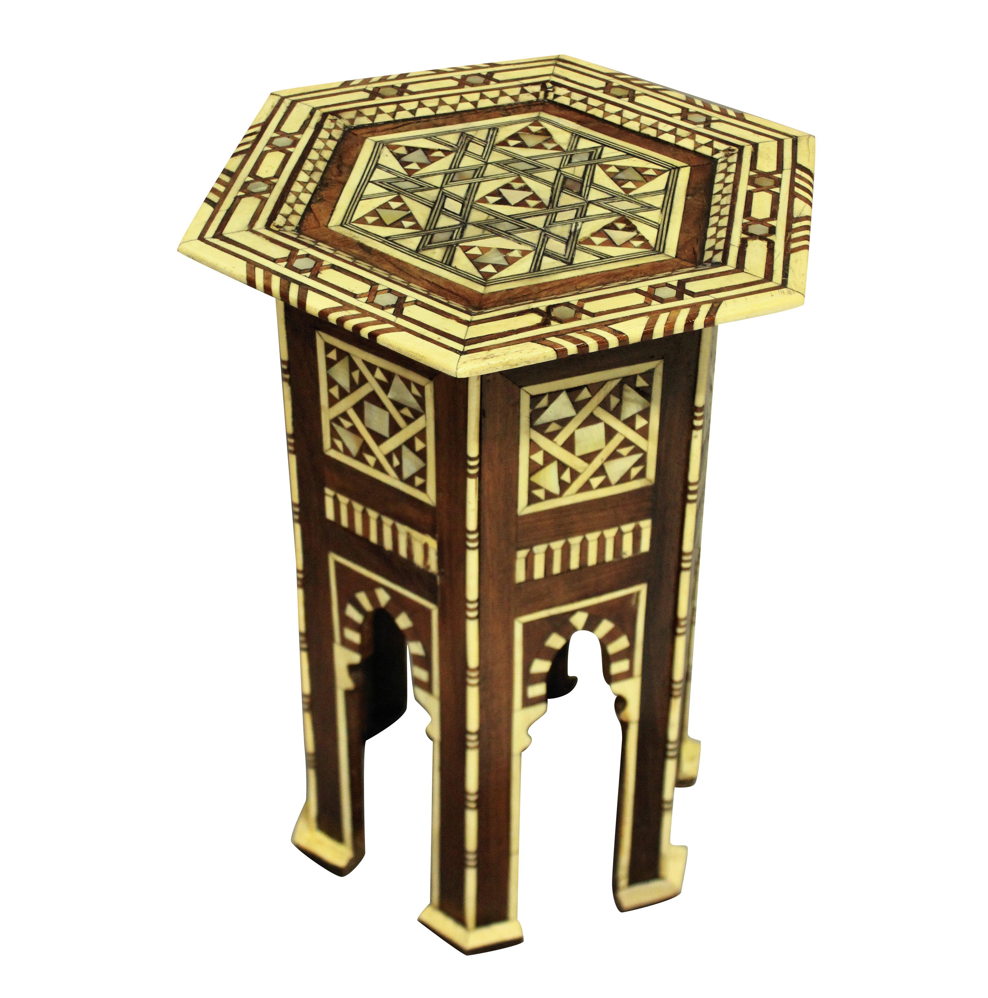 A fine Syrian side table inlaid with bone and mother of pearl in geometric designs.