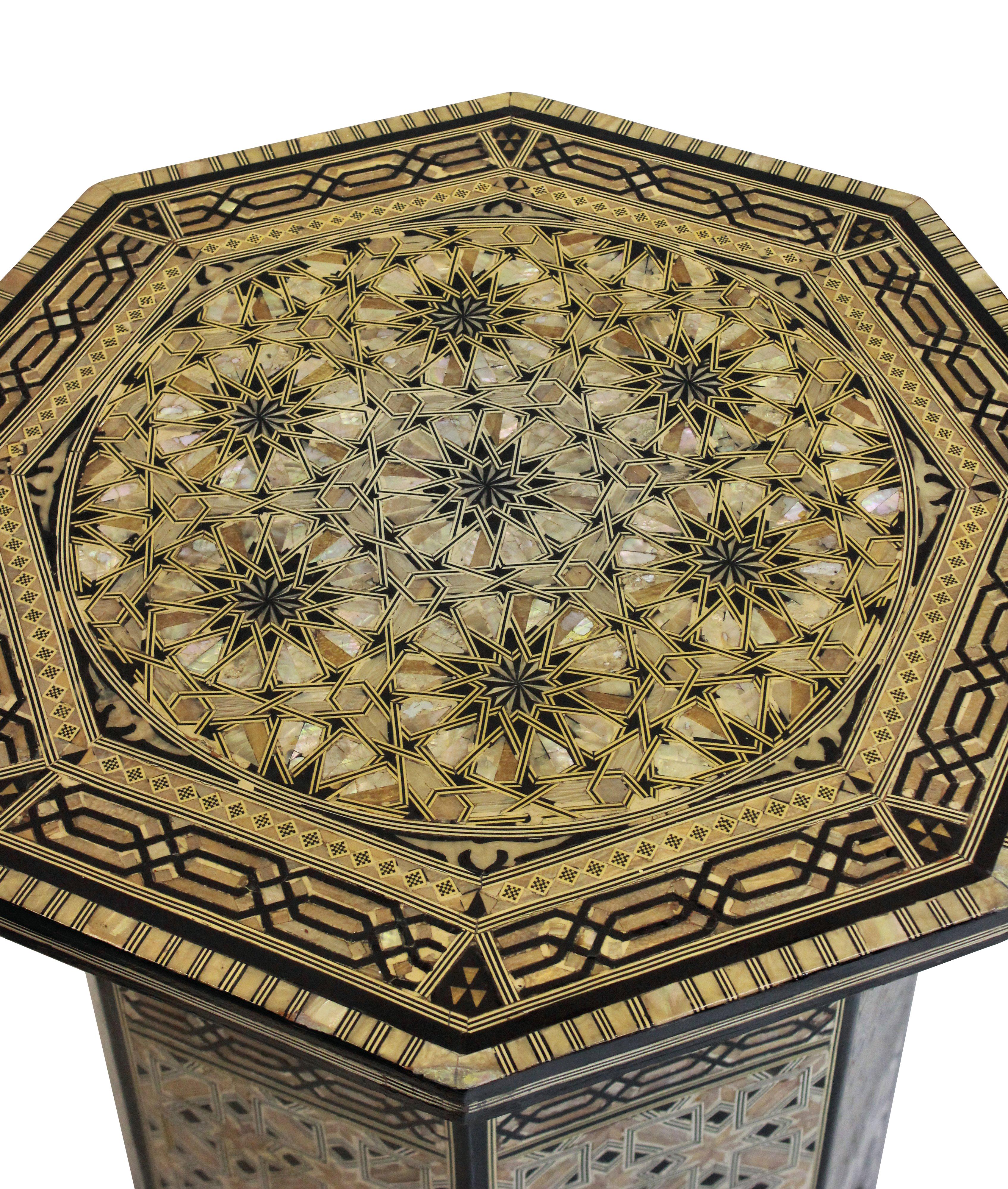 A fine Syrian bone, Horn and mother-of-pearl octagonal inlaid table of intricate detail. With a compartment inside velvet lined.
 
 