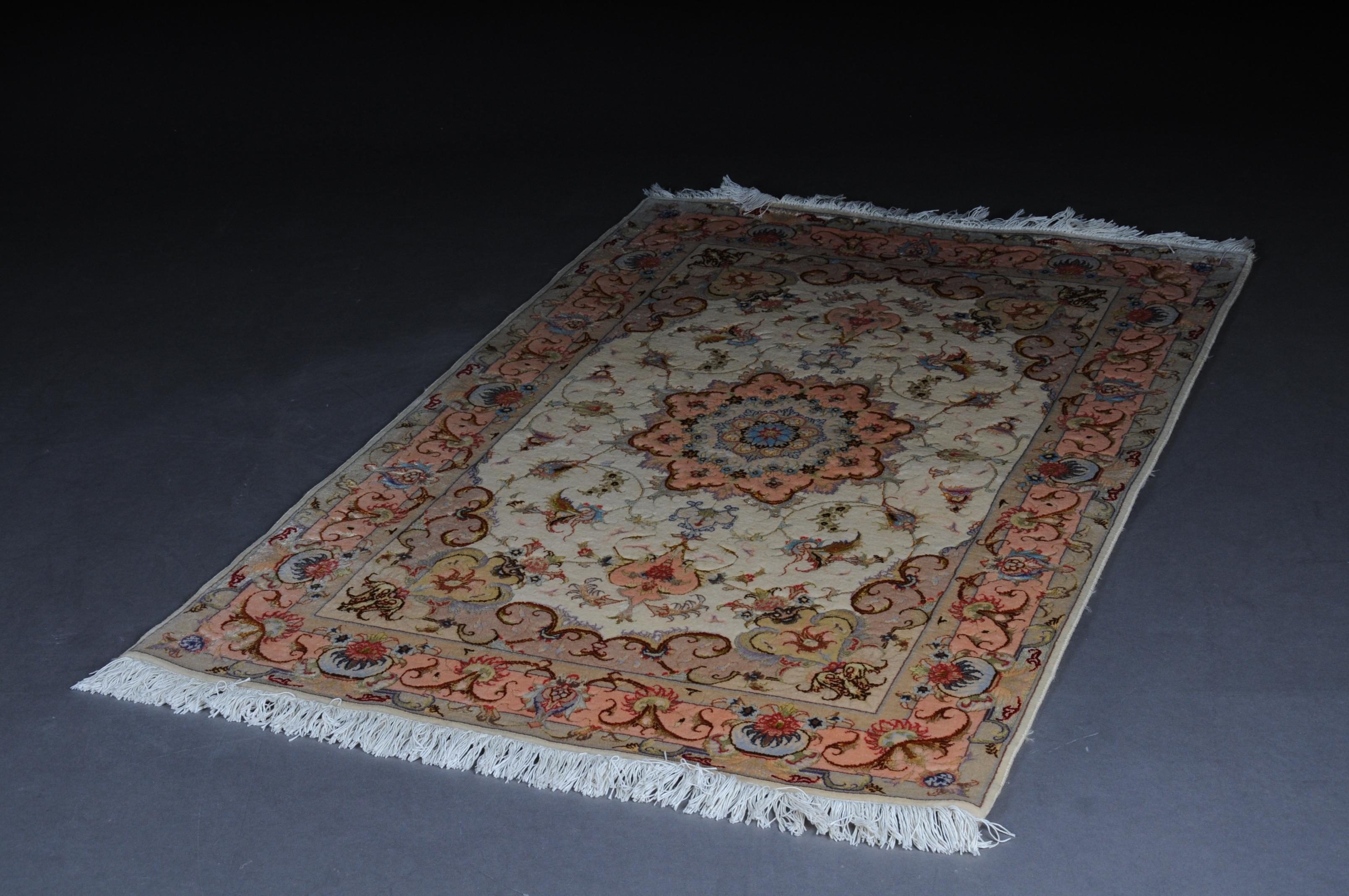 Fine Tabriz cork wool with silk, circa 1980, 160 x 100 cm

Finely woven Tabriz carpet with cork wool and silk. Symmetrically structured decors on a pastel colored background. A star-shaped mandala in the center. Recently professionally cleaned