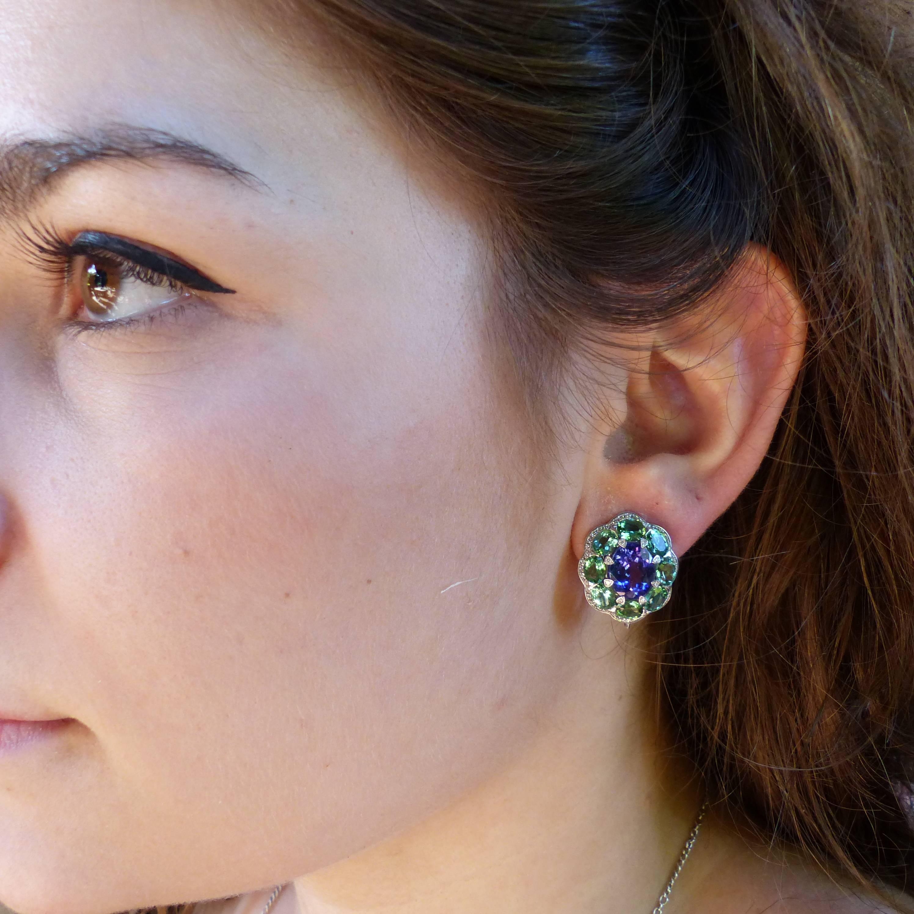 Thomas Leyser is renowned for his contemporary jewellery designs utilizing fine gemstones. 

These 18k white gold (15.01g) earrings are set with 2x fine Tanzanites (facetted, oval, 10x8mm, 5.25ct) + 16x Tourmalines (facetted, oval, 5x4mm, 5.35ct) +