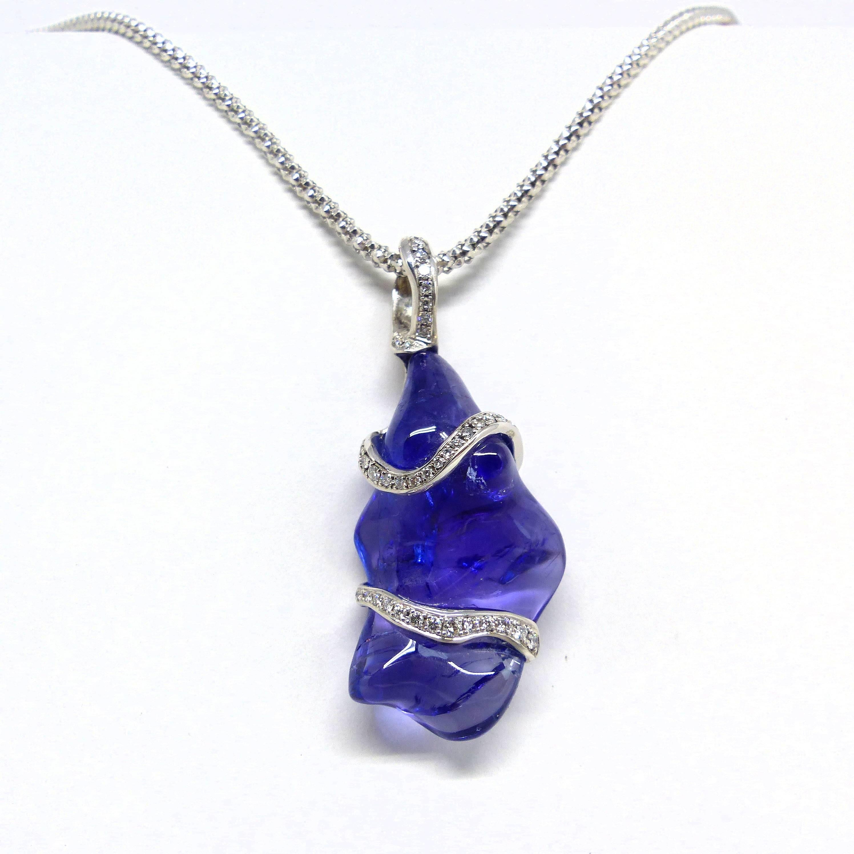 Thomas Leyser is renowned for his contemporary jewellery designs utilizing fine gemstones. 
	
This 18k white gold (4,26gr.) pendant is set with 1 top quality Tanzanite freeschape, 35,35cts., accentuated by 43 diamonds 0,38cts., brillant cut round