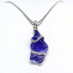 Pendant in White Gold with 1 Tansanite Free Shape and Diamonds.