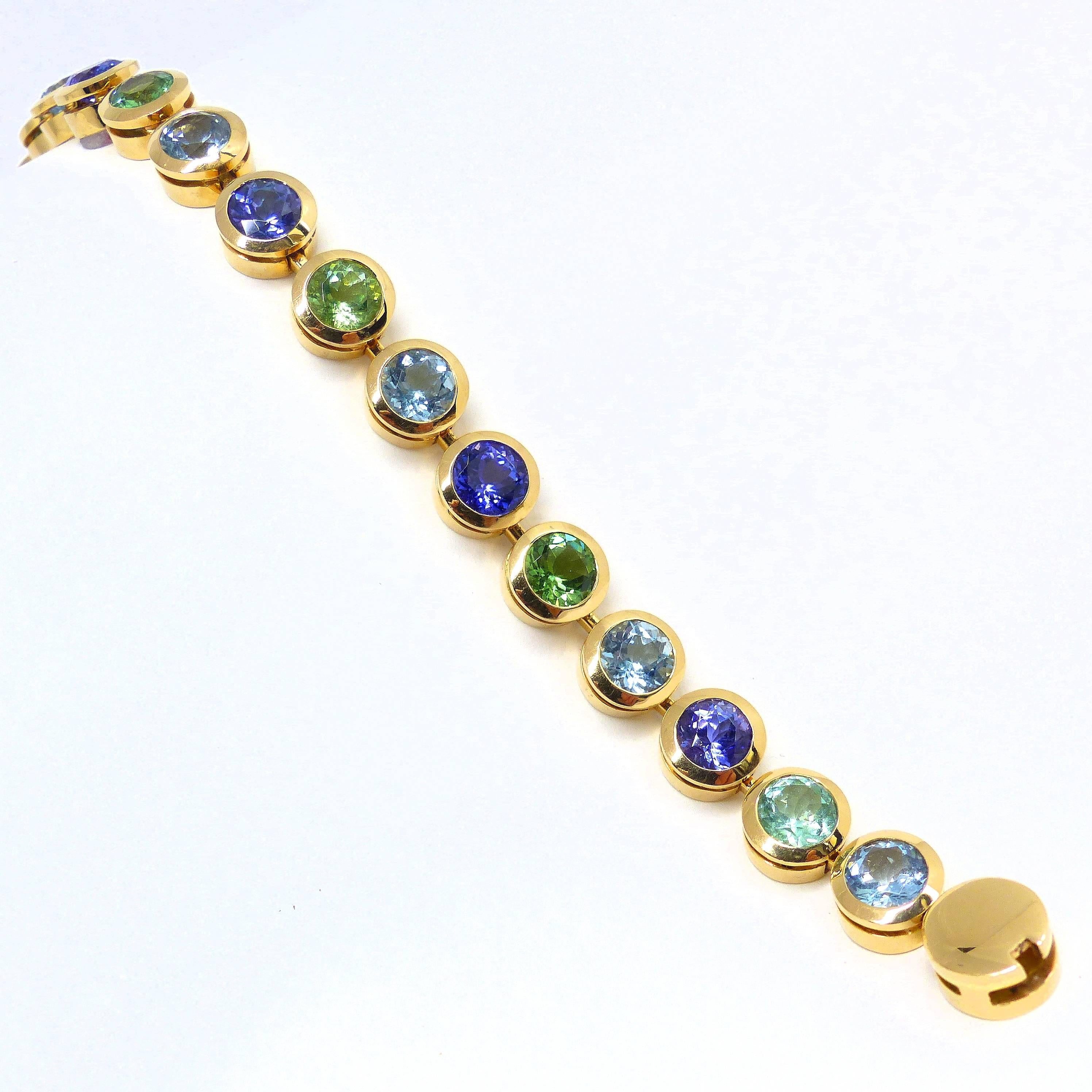 Thomas Leyser is renowned for his contemporary jewellery designs utilizing fine gemstones. 

This 18k rose gold (51.74g) bracelet contains 15 top quality faceted Tanzanites round 8mm (10.82ct), Aquamarines (8.42ct) and Tourmalines (9.23ct). Length