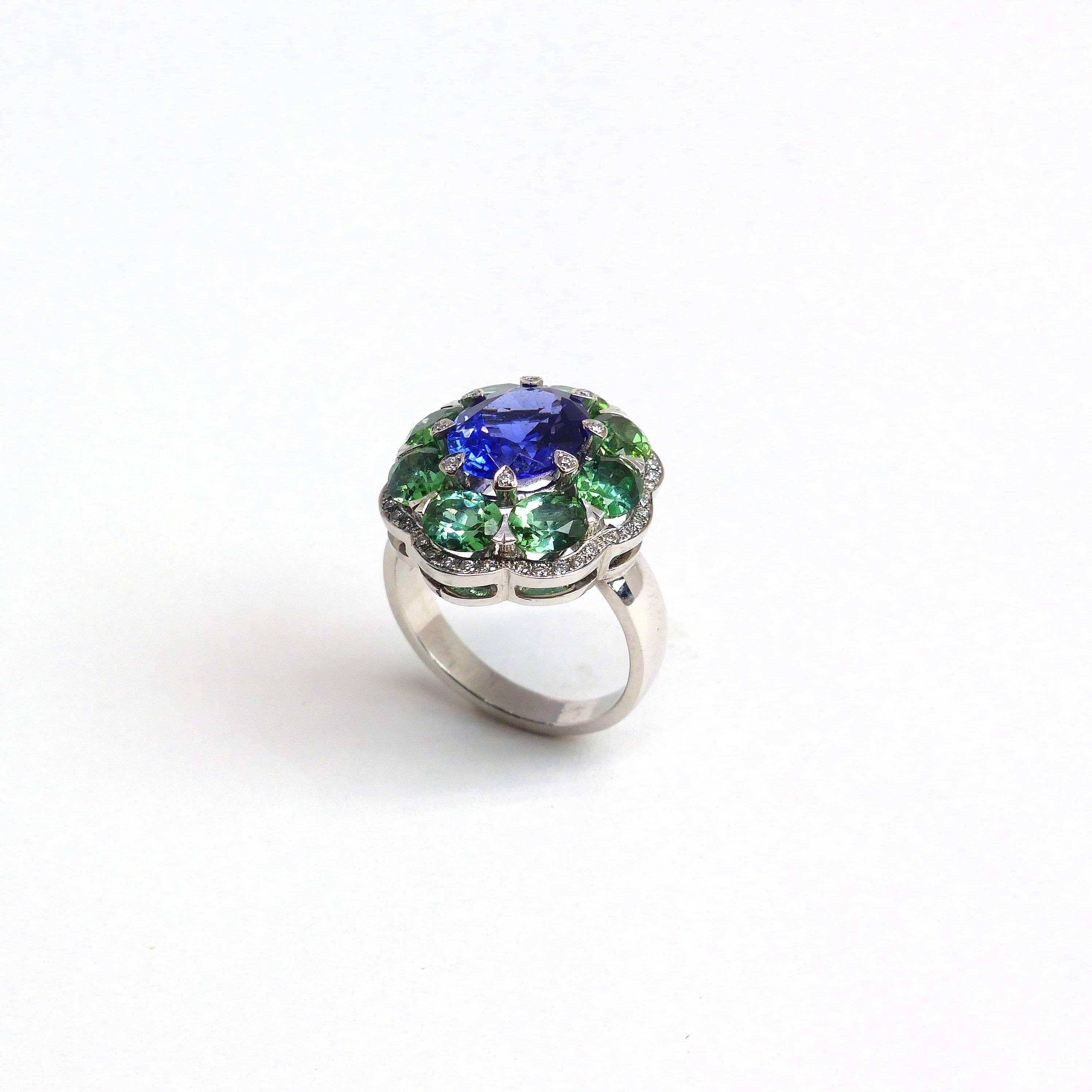 Thomas Leyser is renowned for his contemporary jewellery designs utilizing fine gemstones. 

This 18k white gold (9.33g) ring is set with 1x fine Tansanite (facetted, oval 10x8mm, 2.90ct) + 8x fine Tourmalines (oval, 5x4mm, 2.71ct) + 48x Diamonds